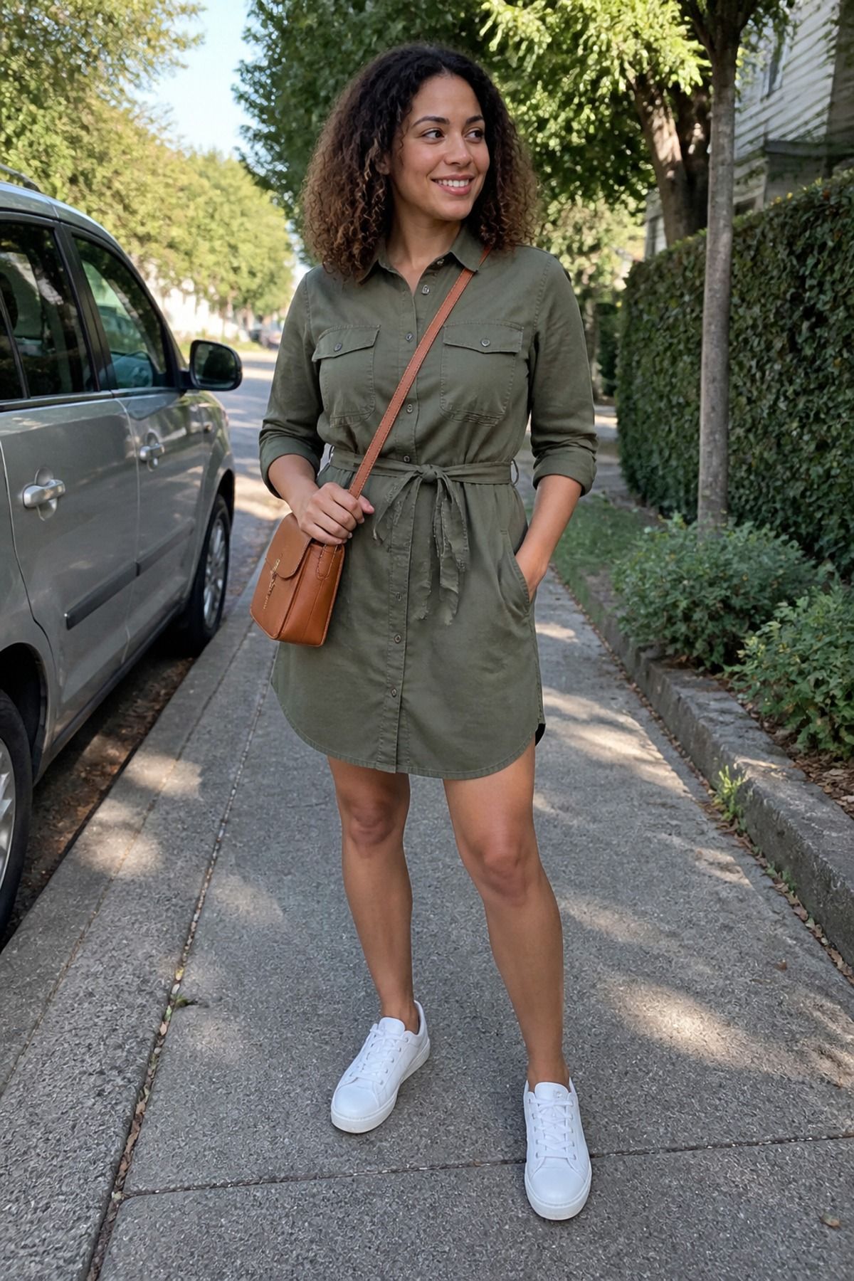 Woman wearing an utility dress with white sneakers