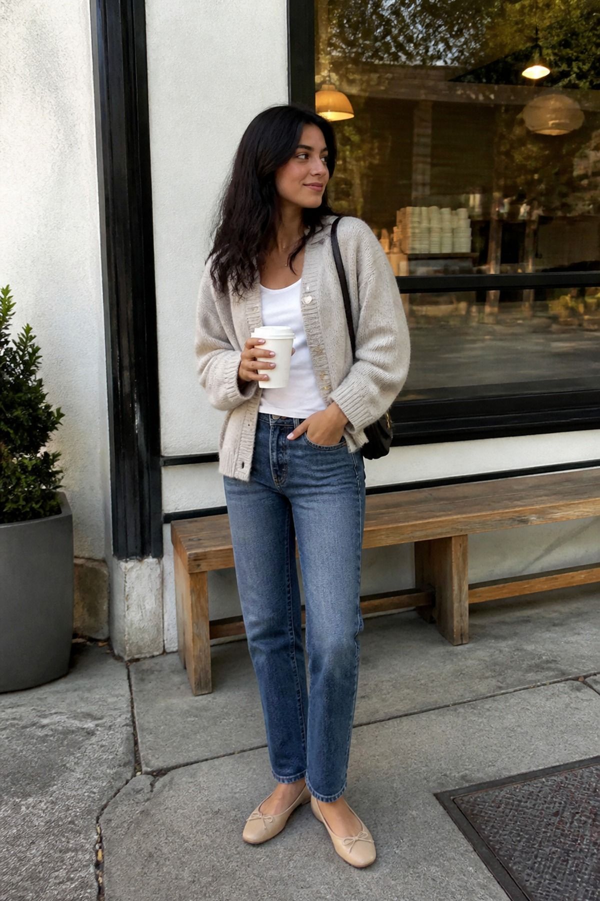 Woman wearing straight jeans with a soft cardigan, a weekend outfit