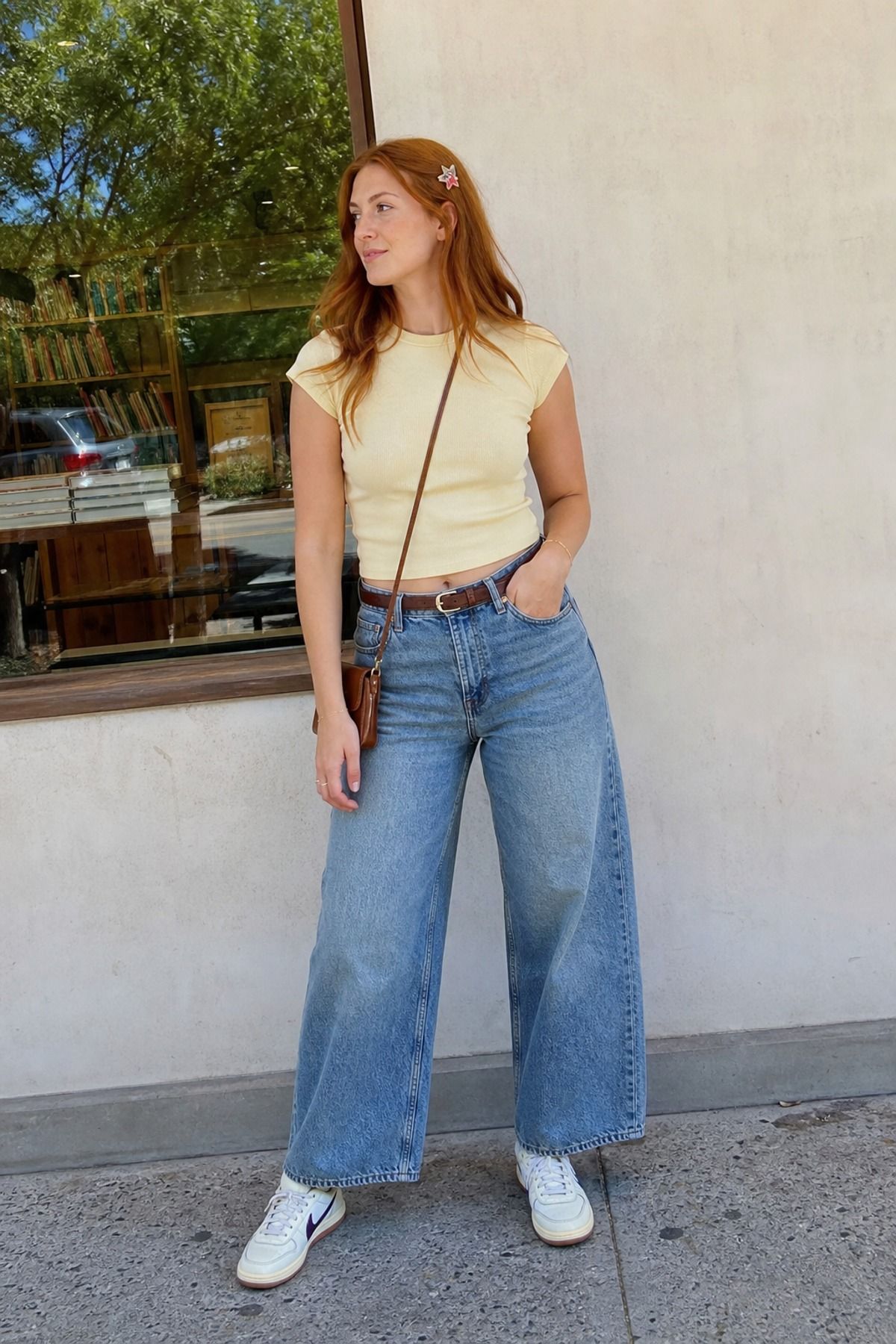 Woman wearing wide-leg jeans with a baby tee, a weekend outfit