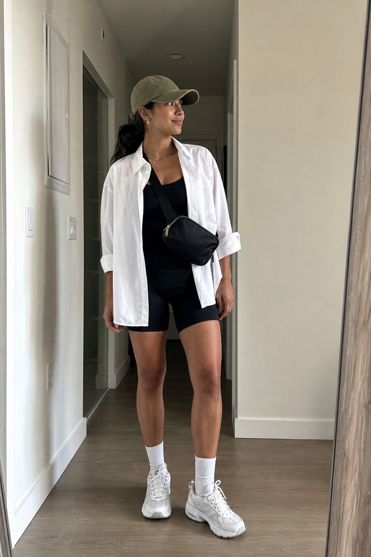 Woman wearing a button down with bike shorts, a weekend outfit