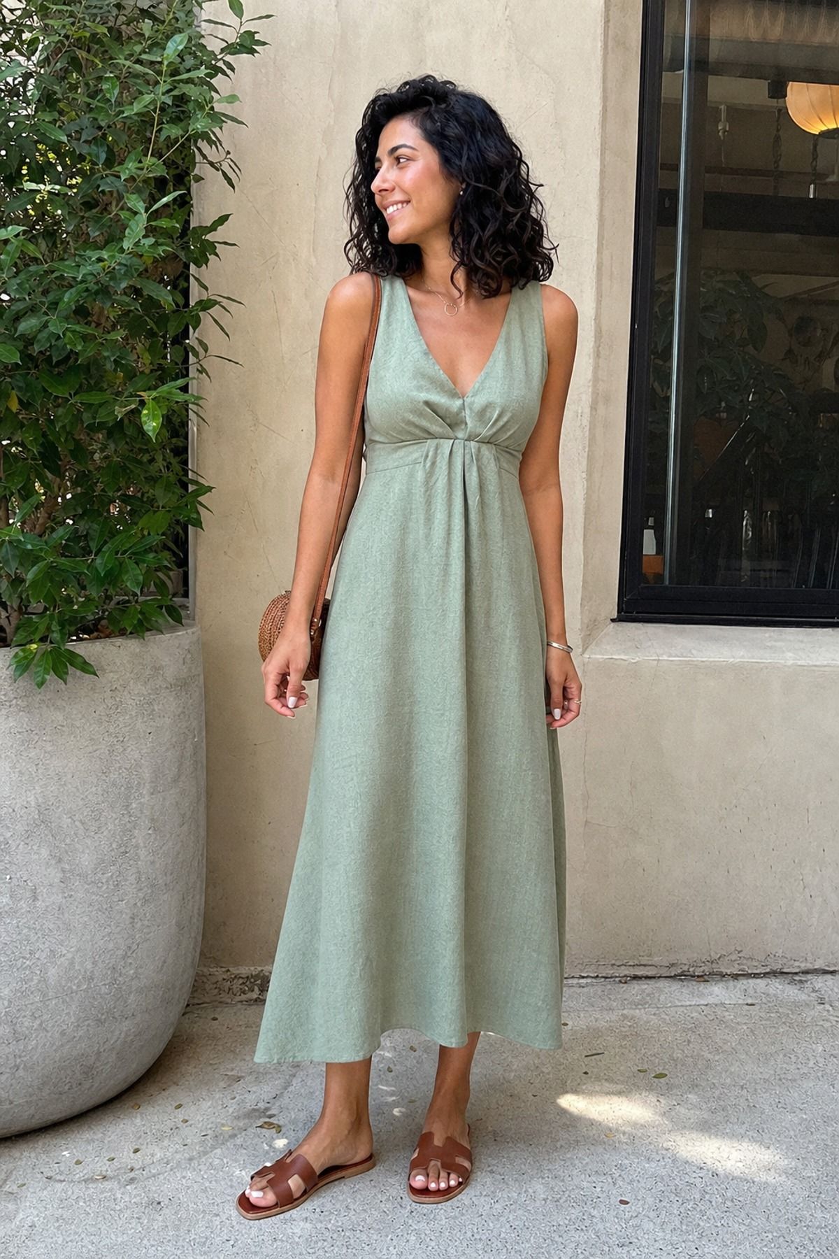 Woman wearing a midi dress with flat sandals, a weekend outfit