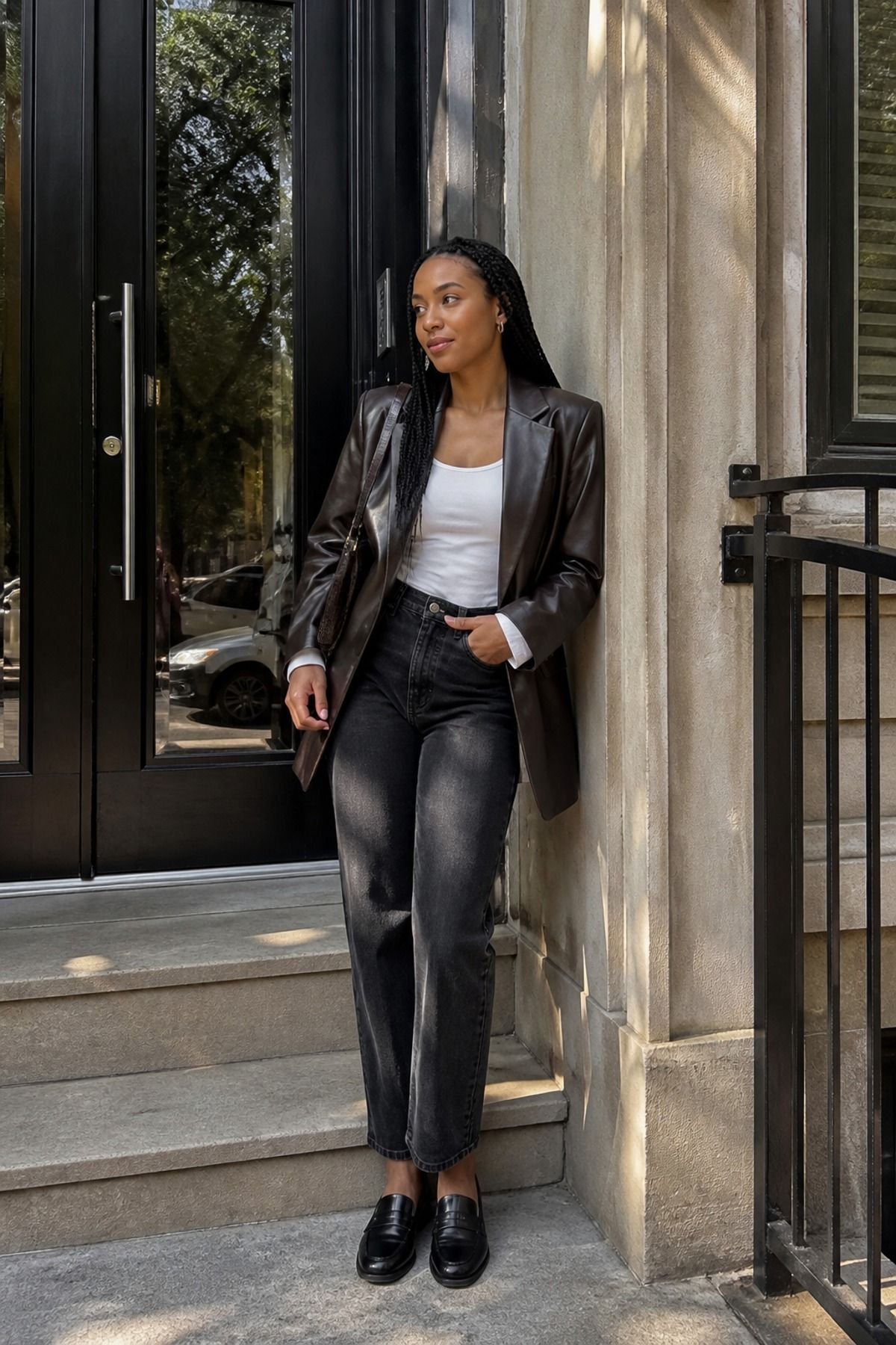 Woman wearing jeans with a leather blazer, a jeans and blazer outfit
