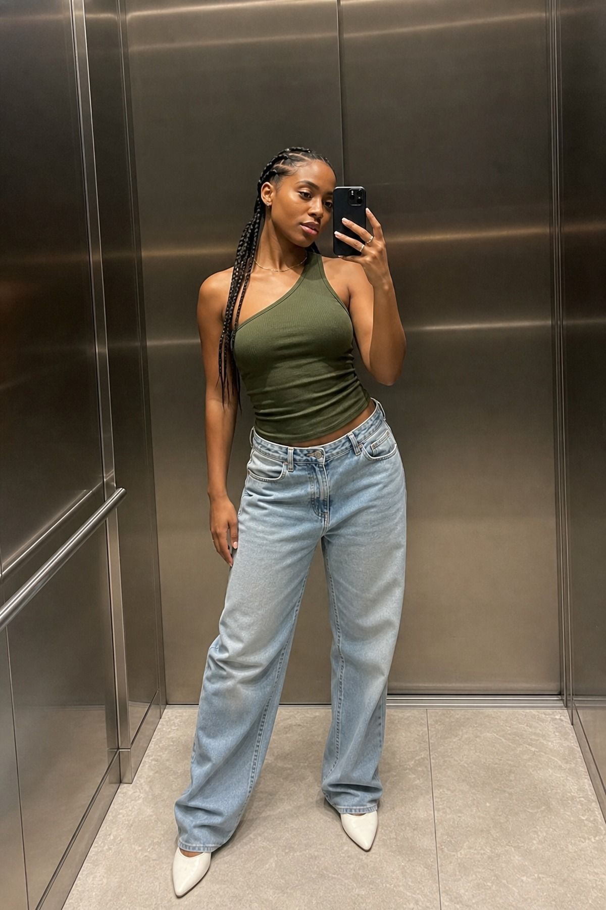 Woman wearing jeans with a one-shoulder top, a jeans and nice top outfit