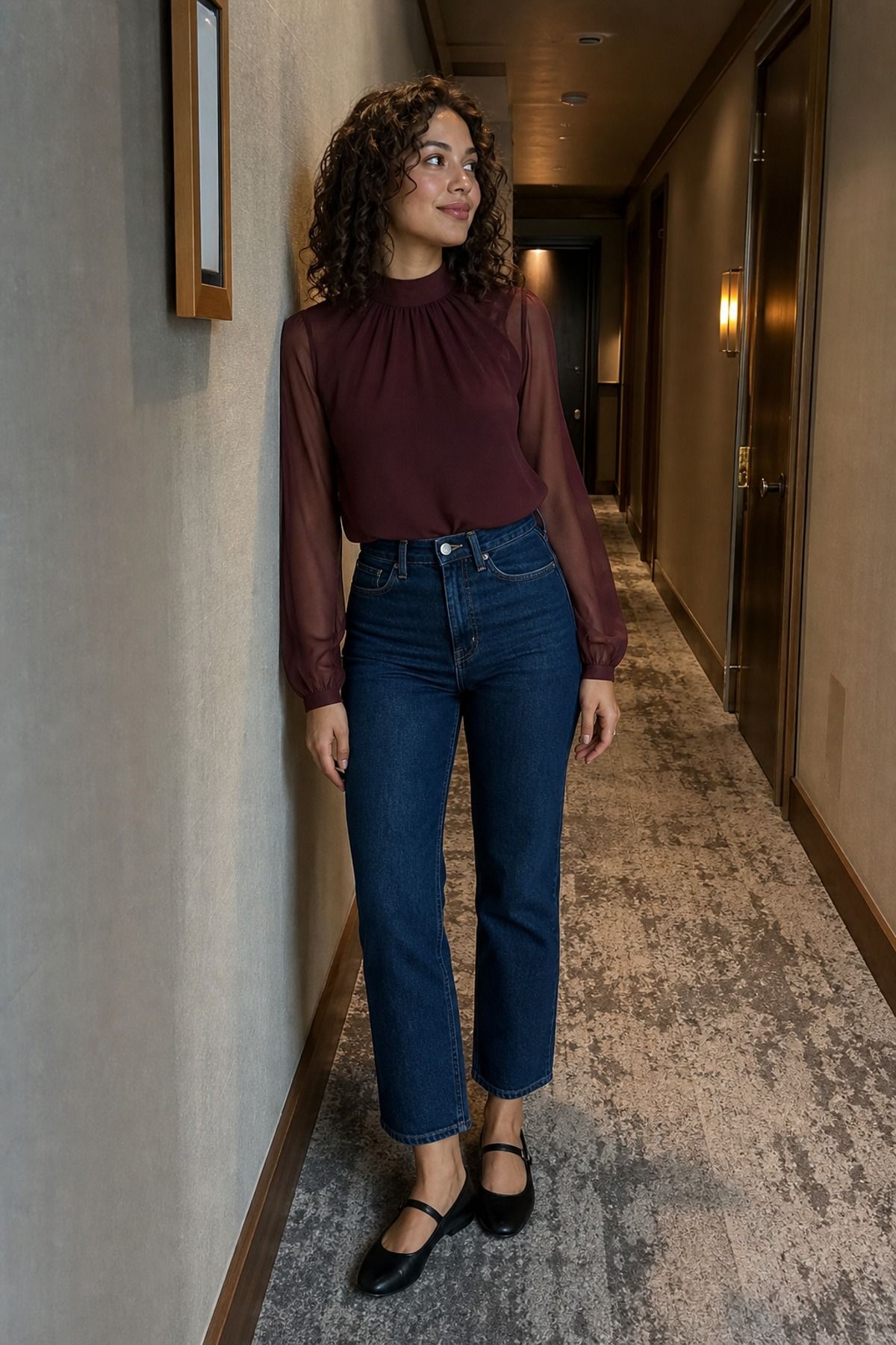 Woman wearing jeans with a sheer sleeve top, a jeans and nice top outfit