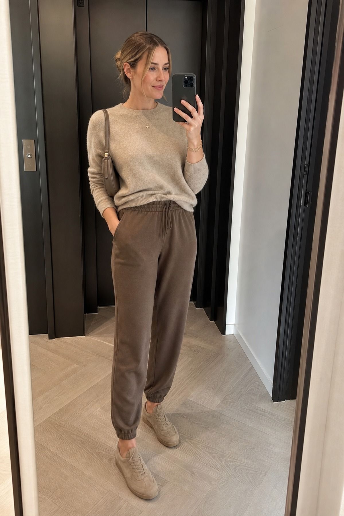 Woman wearing joggers with a cashmere sweater