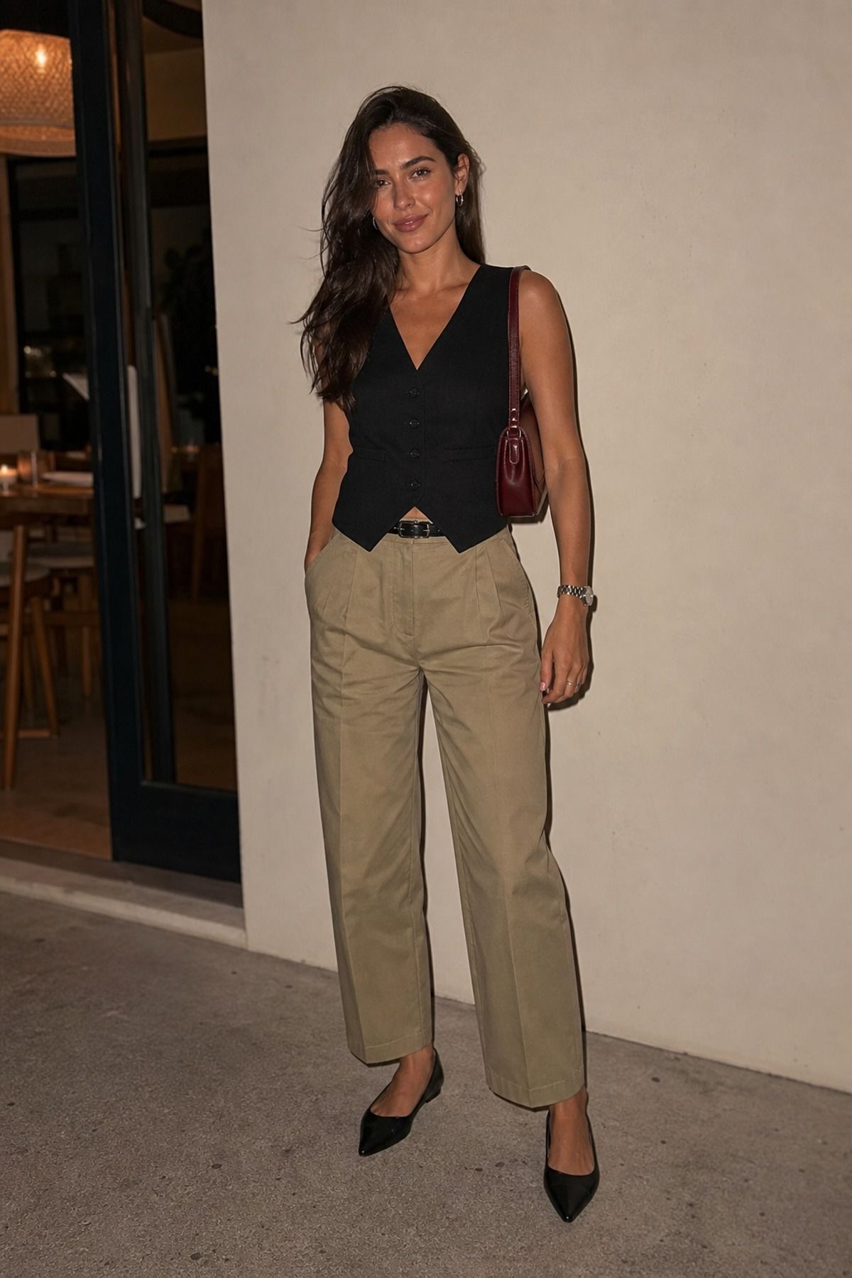 Woman wearing khaki pants with a vest