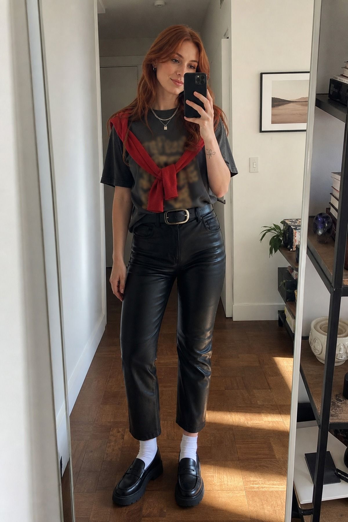 Woman wearing leather pants with graphic tee