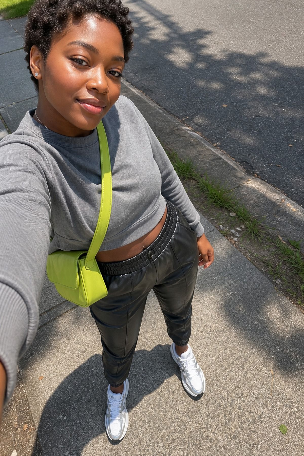 Woman wearing leather pants with sneakers