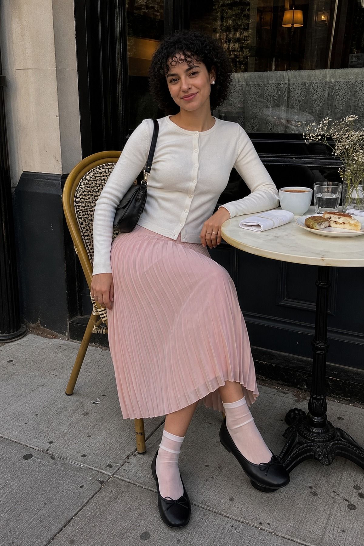Woman wearing a pleated skirt with ballet flats