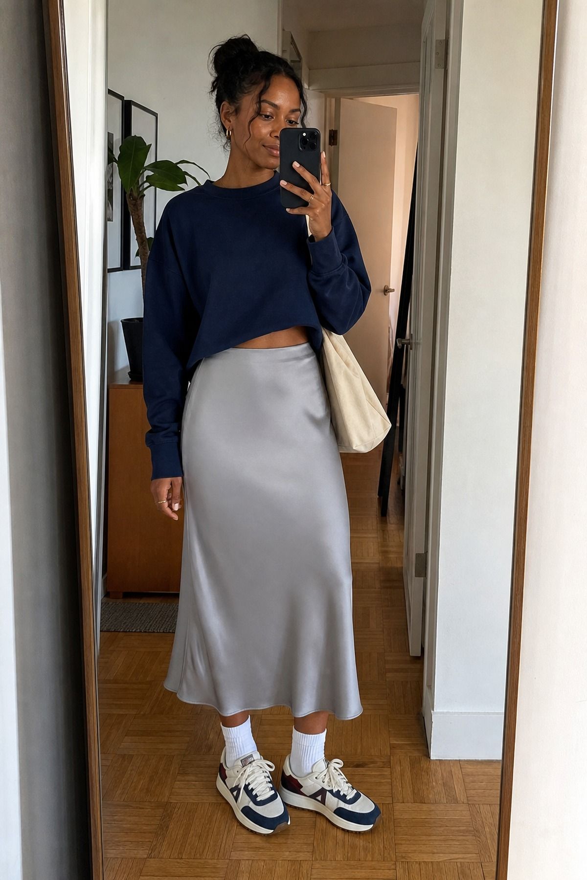 Woman wearing a satin skirt with sneakers