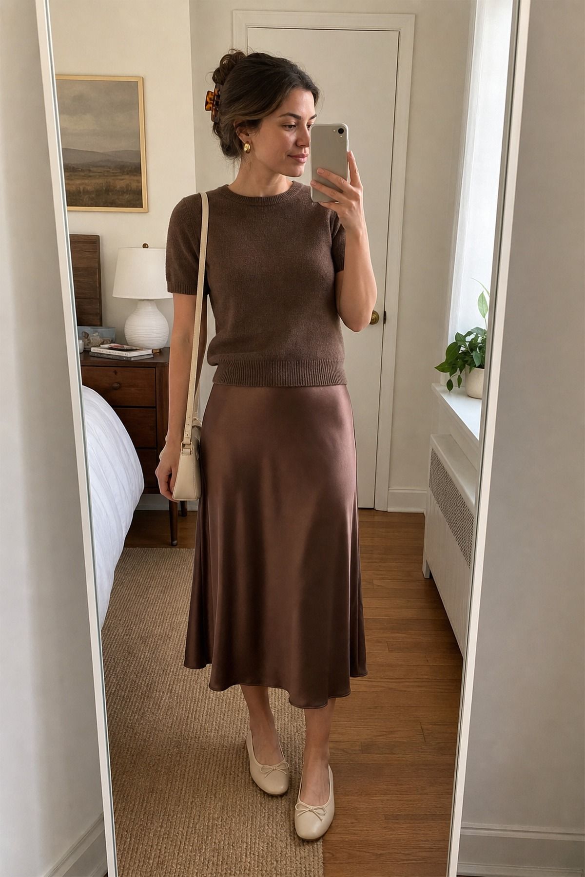 Woman wearing a satin skirt with a matching knit