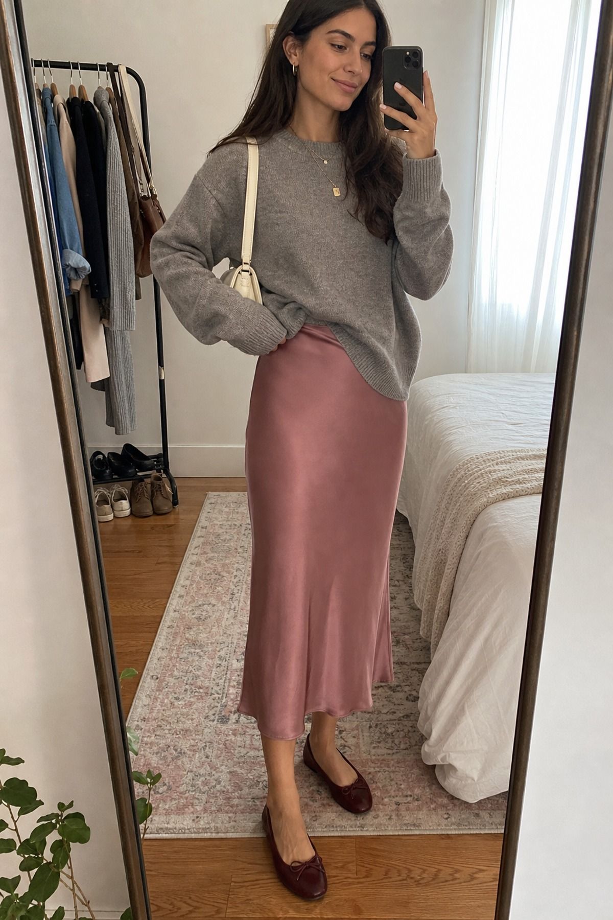 Woman wearing a slip skirt with a crewneck sweater