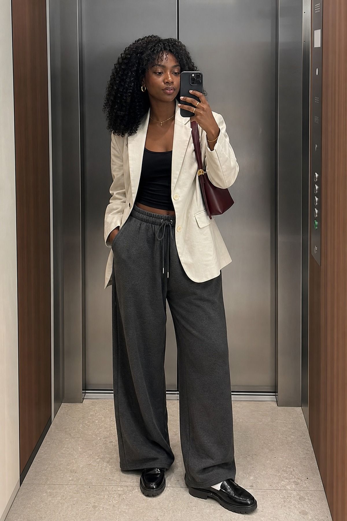 Woman wearing sweatpants with a blazer
