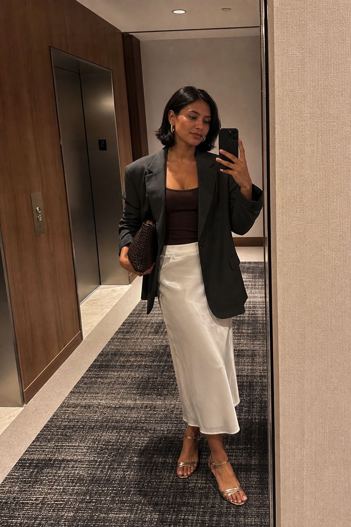 Woman wearing a white skirt with a blazer