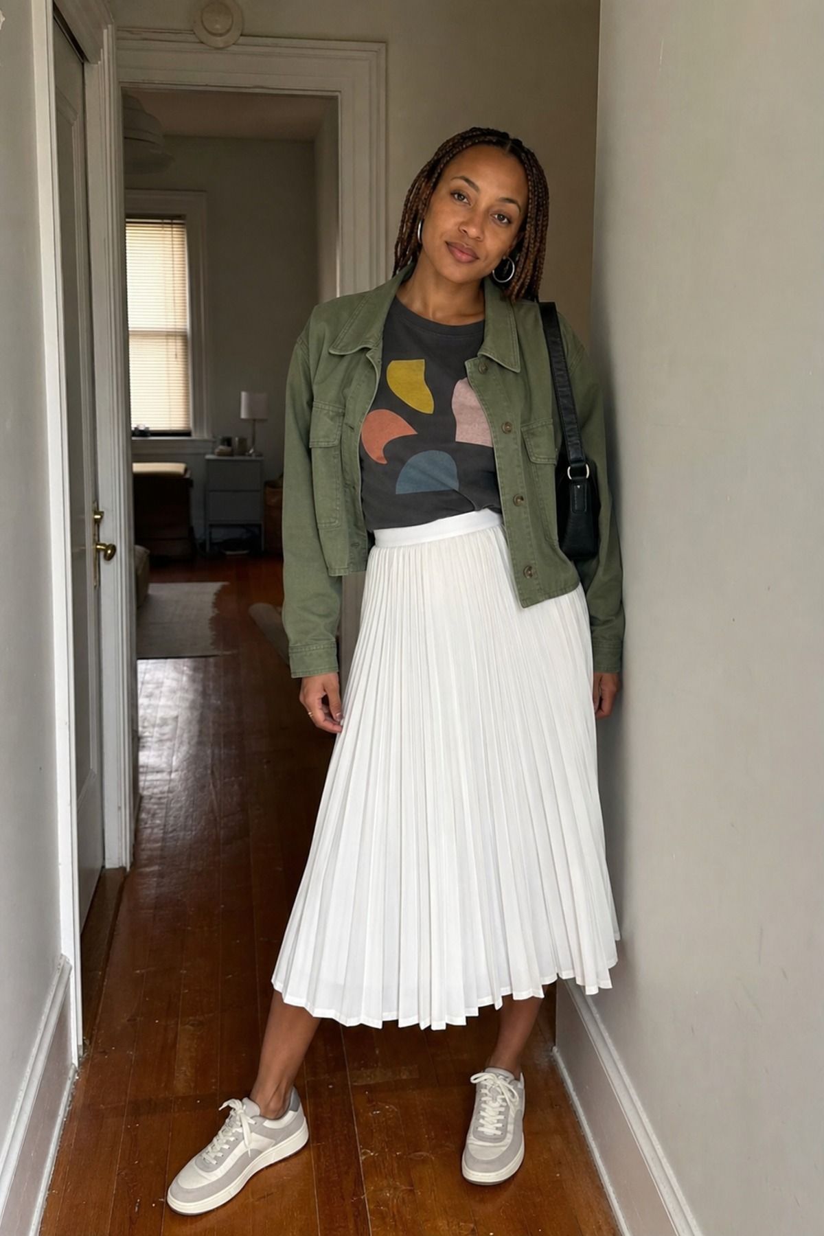 Woman wearing a white skirt with a graphic tee