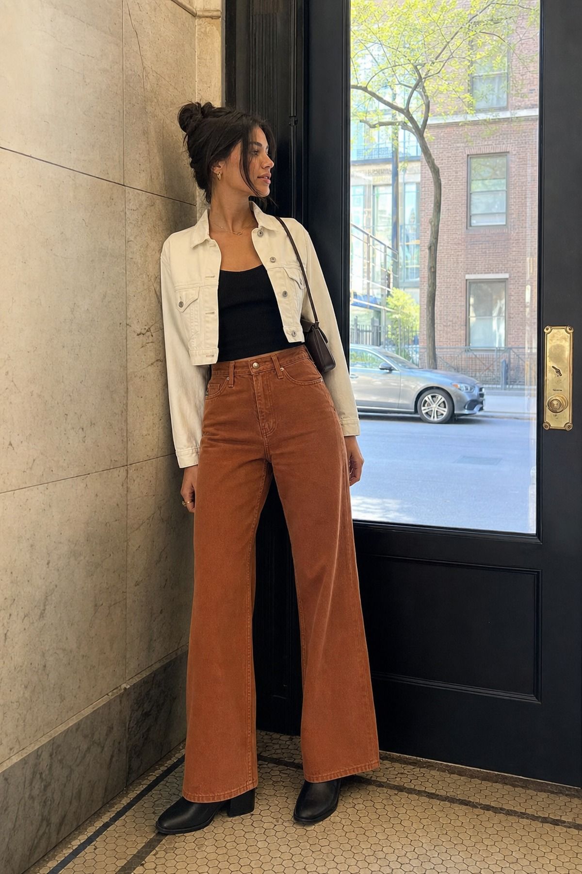 Woman wearing wide leg pants with a cropped jacket