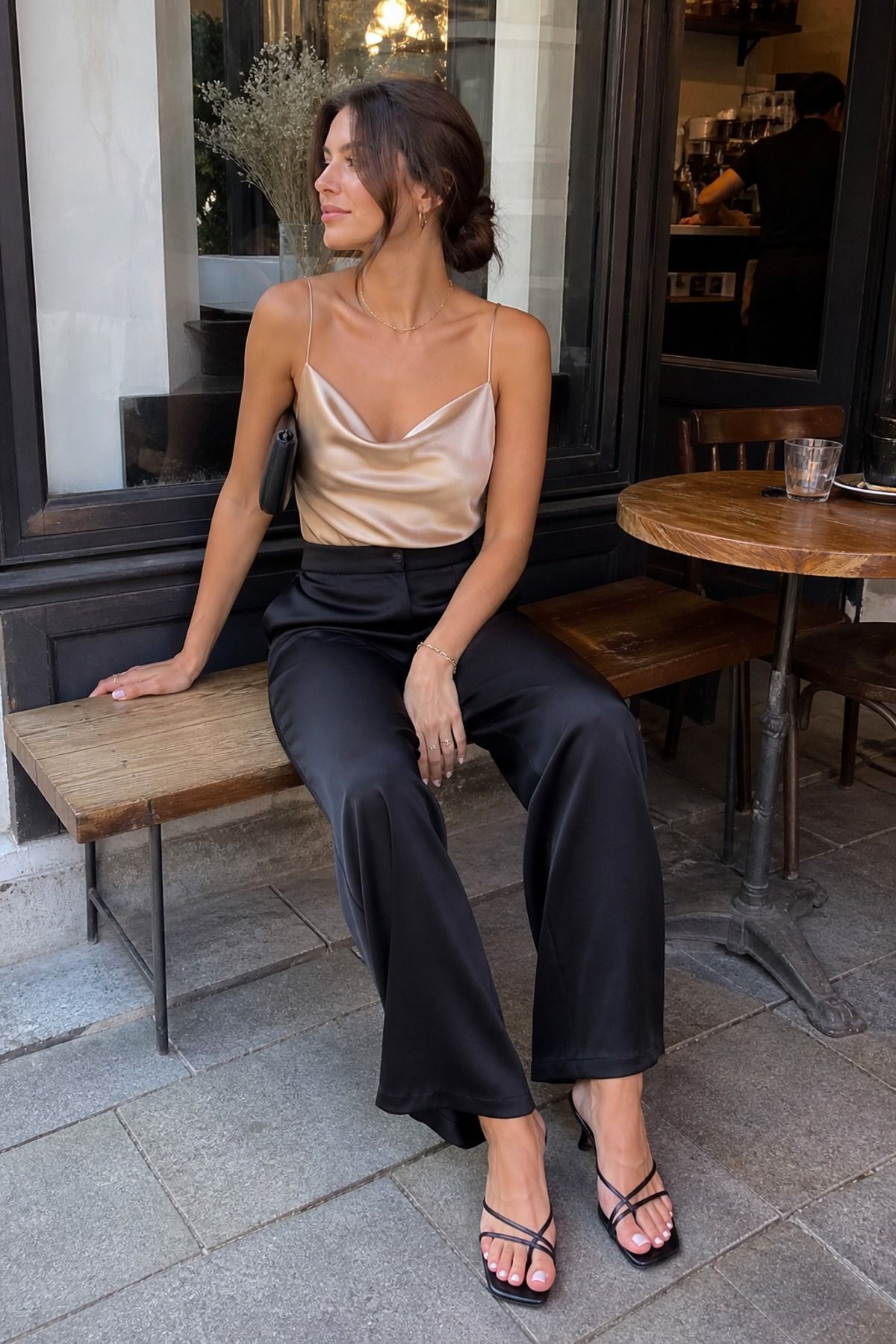 Woman wearing wide leg pants with a silk top