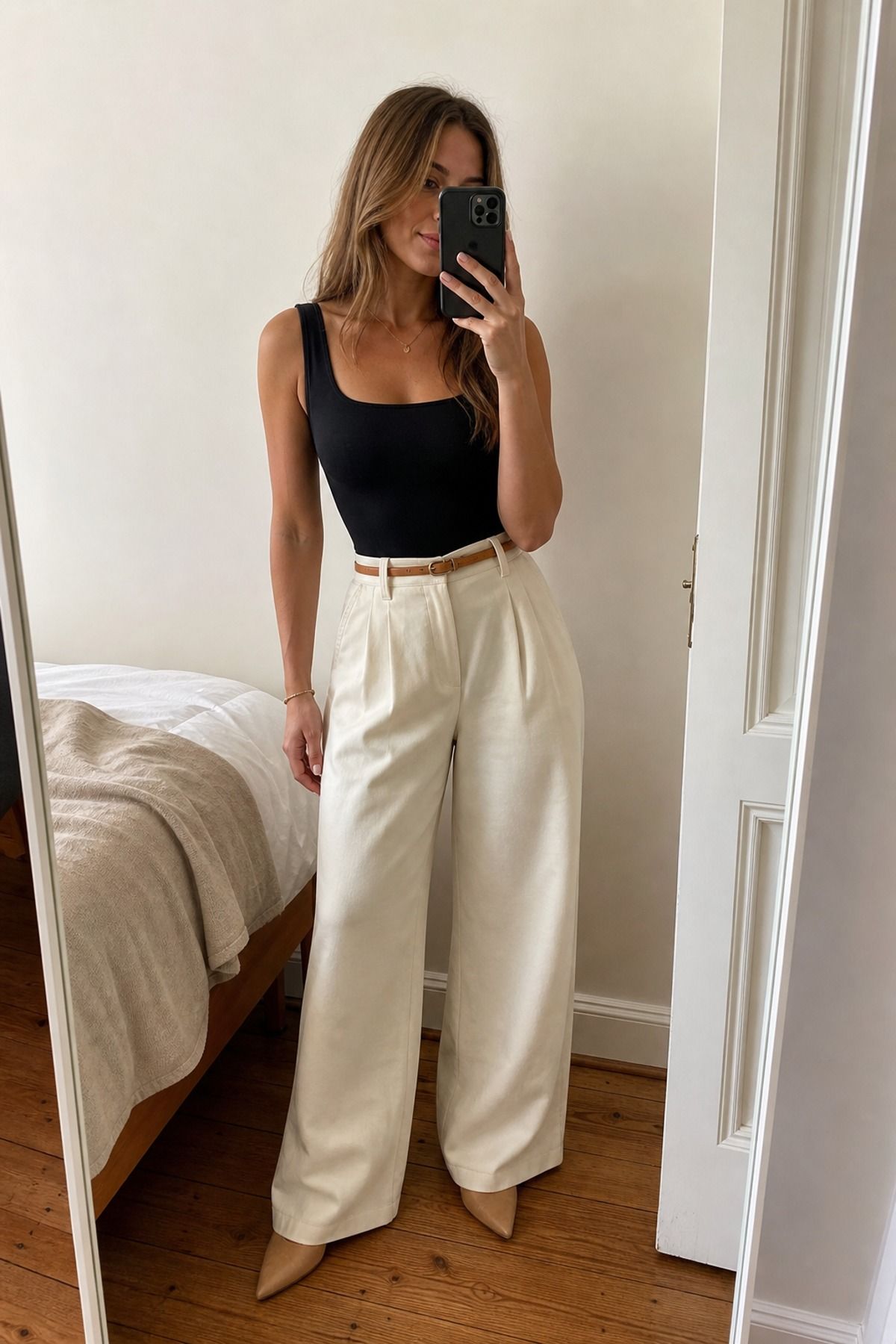 Woman wearing wide leg pants with a bodysuit
