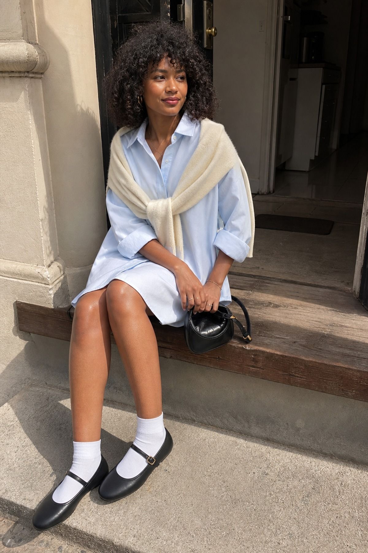 Woman wearing a shirt dress with Mary Janes