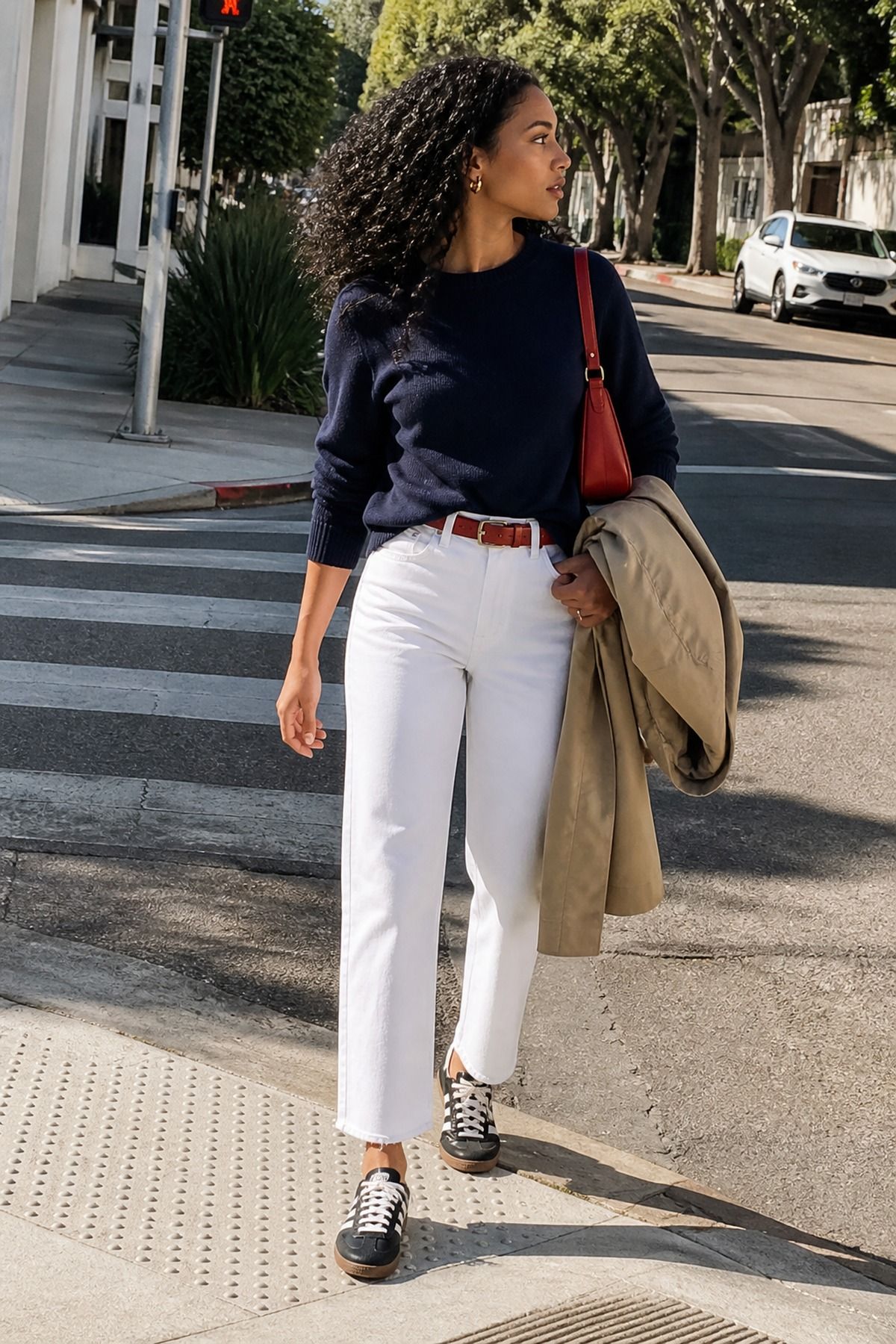 Woman wearing white jeans with Adidas Sambas