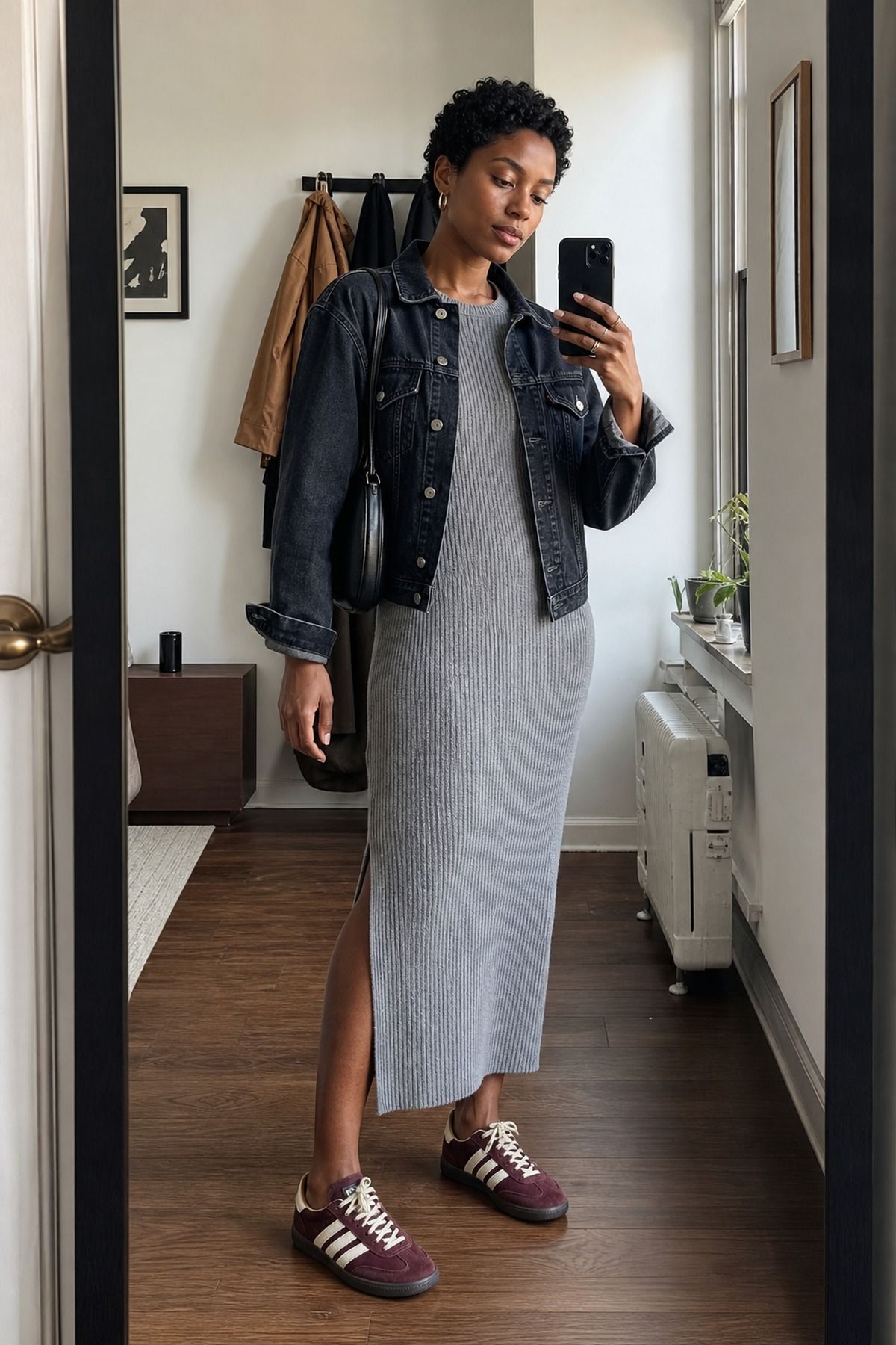 Woman wearing a sweater dress with Adidas Sambas