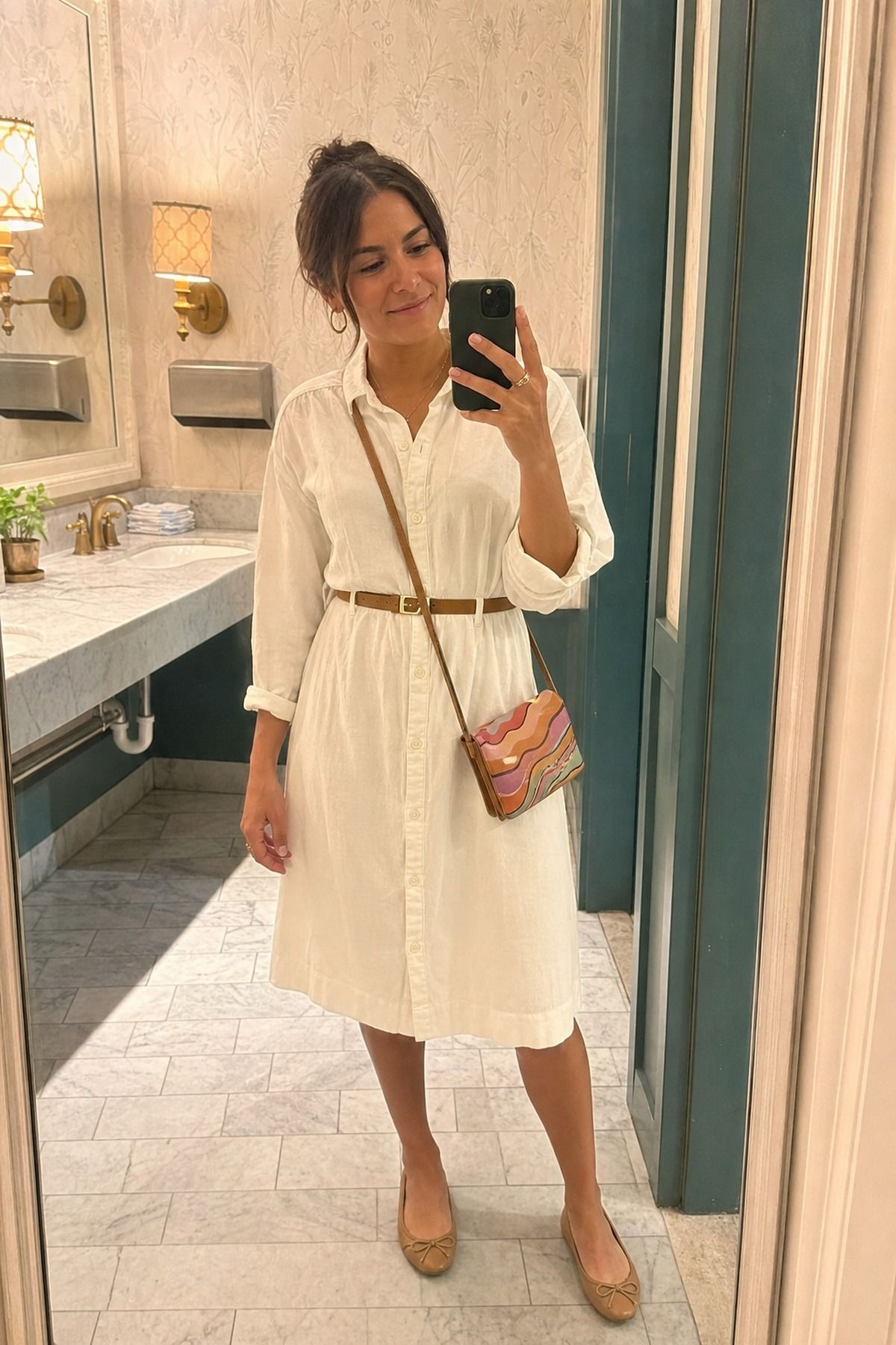 Woman wearing a button-down dress with ballet flats
