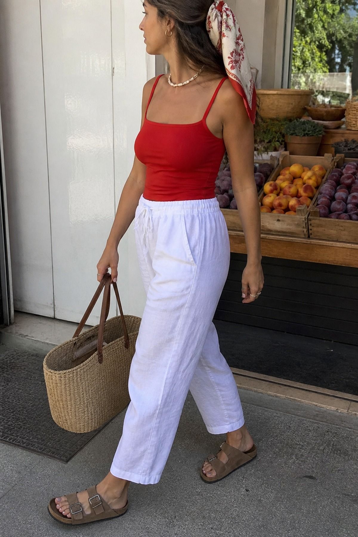 Woman wearing linen pants with Birkenstocks