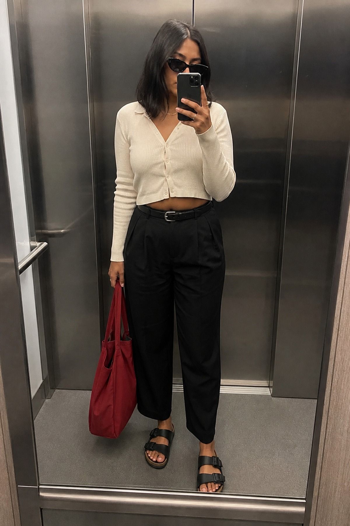 Woman wearing black trousers with Birkenstocks