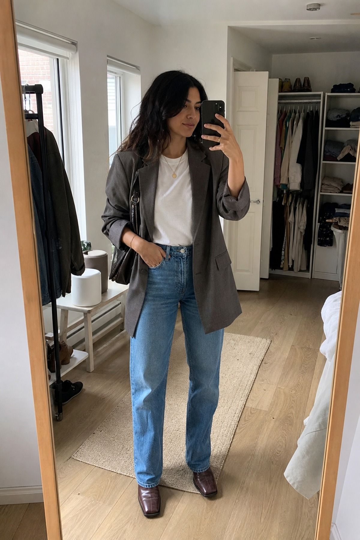 Woman wearing an oversized blazer with straight jeans and a white tee