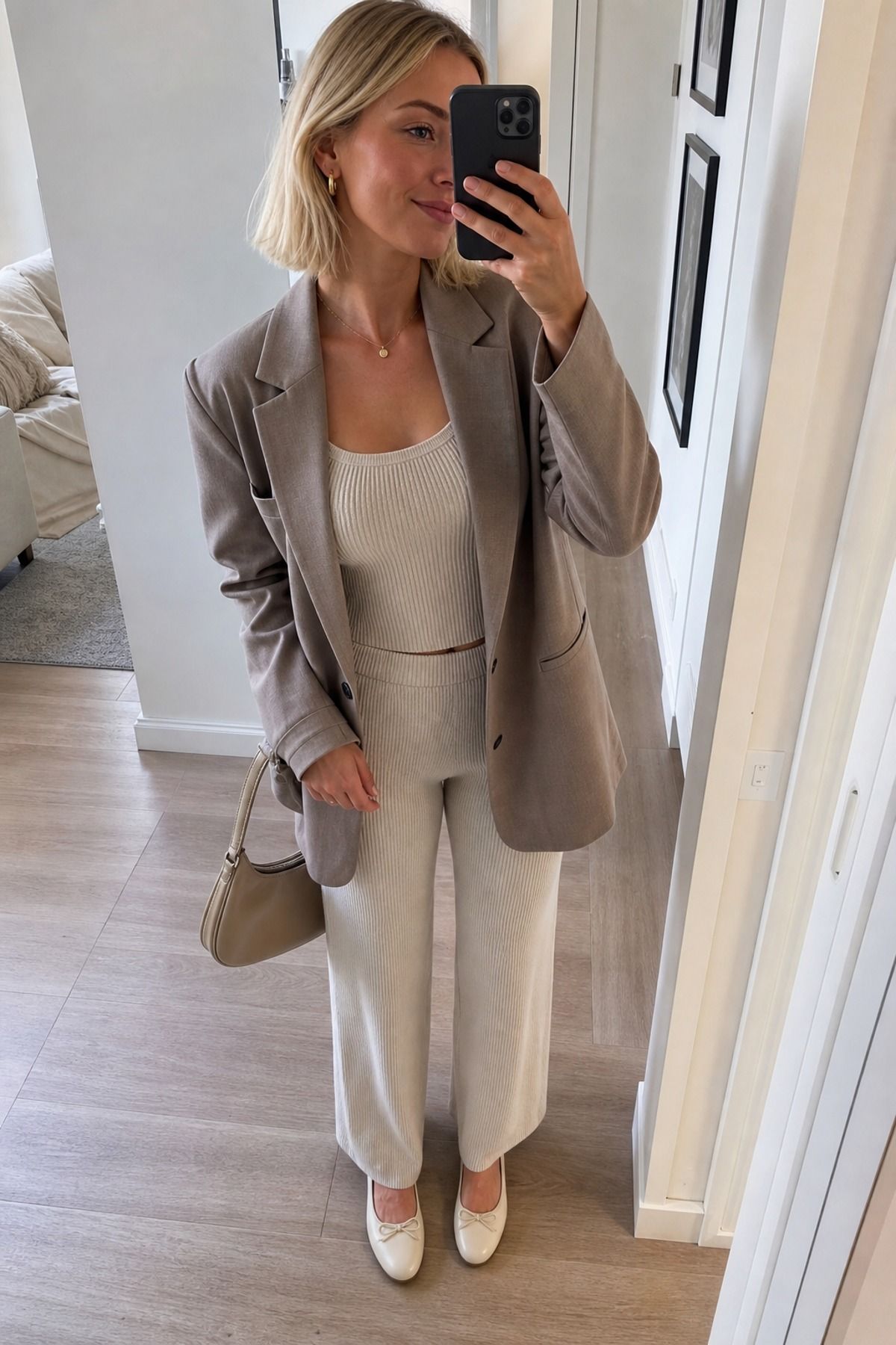 Woman wearing a blazer over a knit set