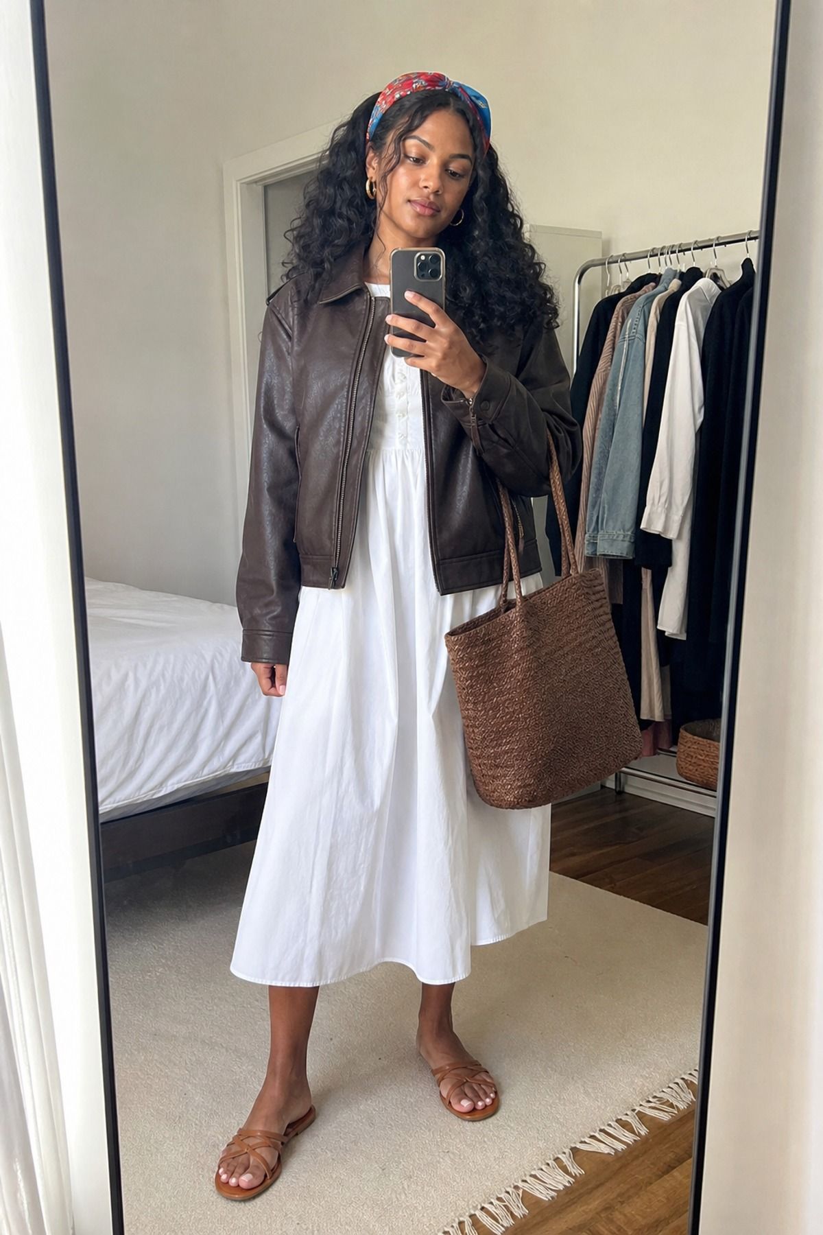 Woman wearing a leather jacket with a cotton poplin dress