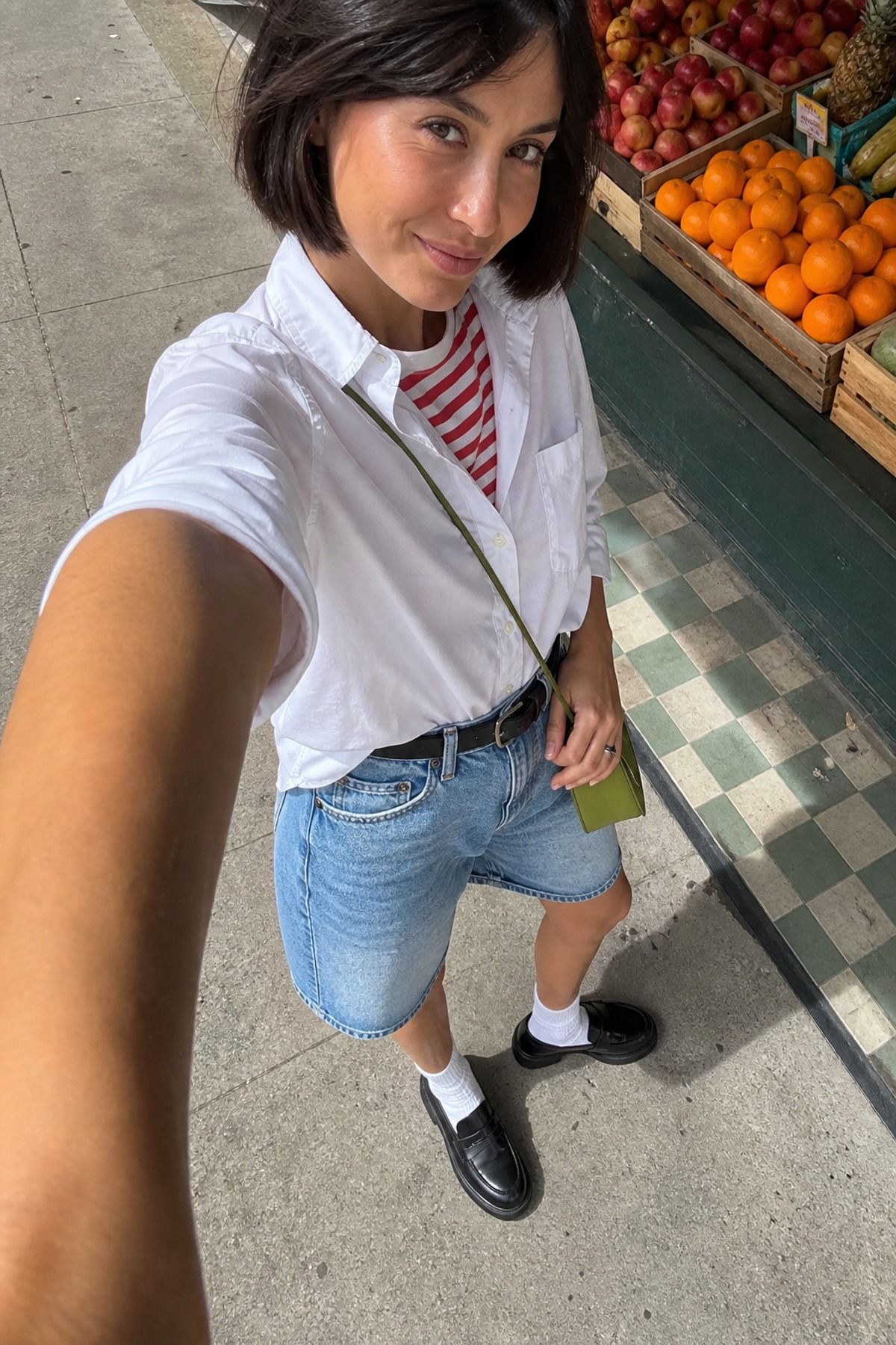 Woman wearing denim shorts with loafers