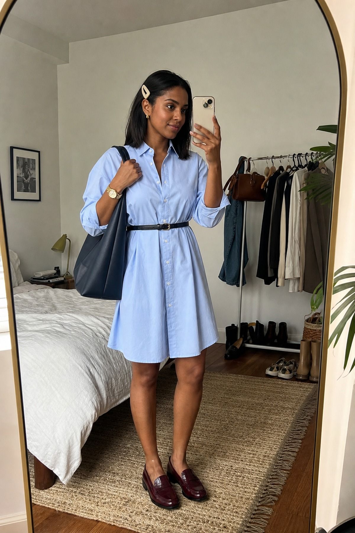 Woman wearing a button-down dress with loafers