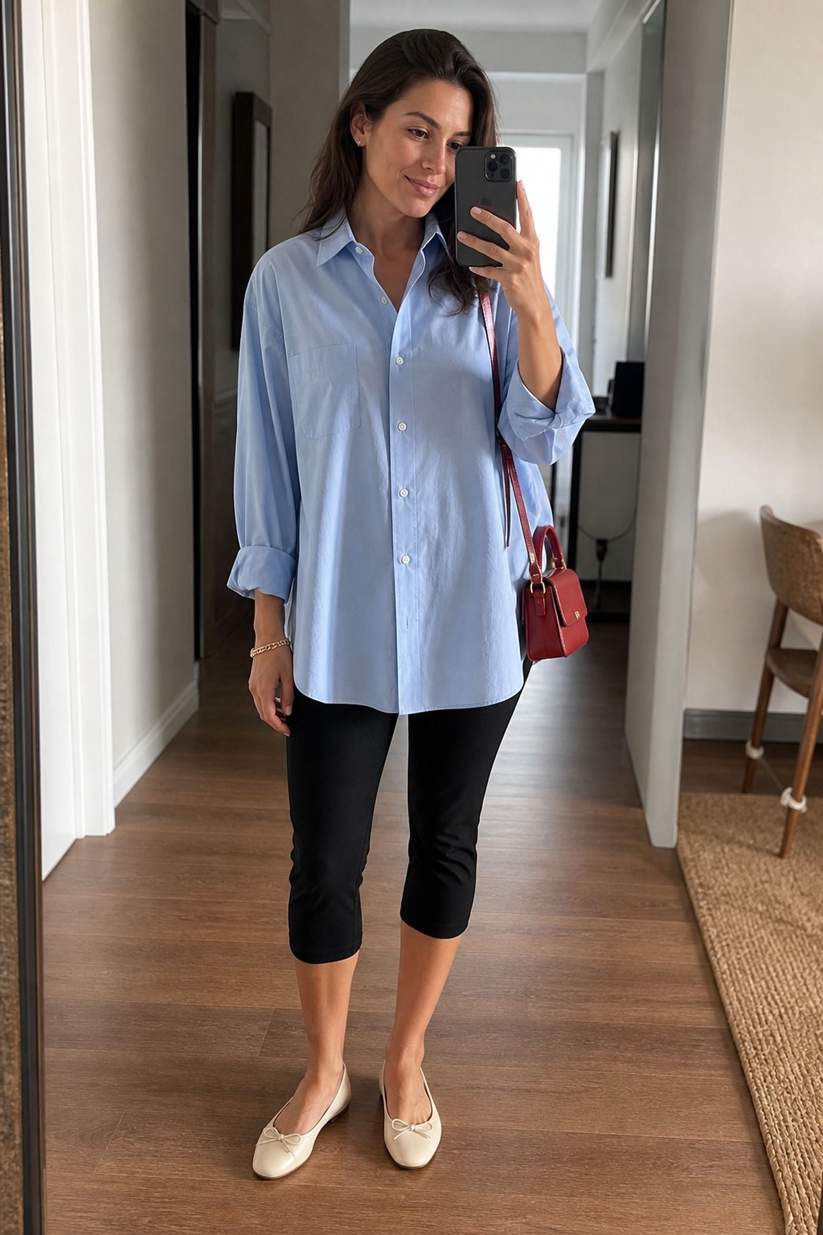 Woman wearing an oversized shirt with capri pants