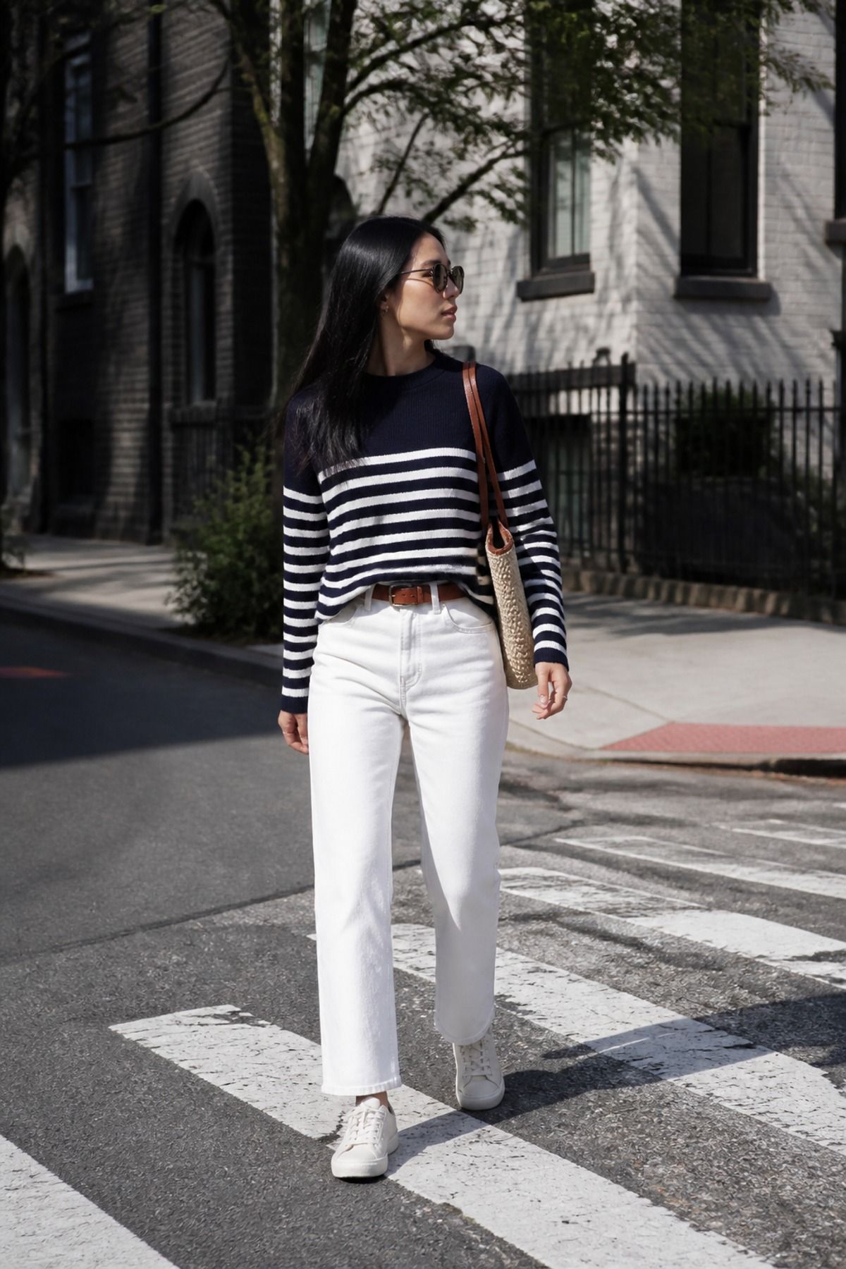 Woman wearing white jeans with sneakers