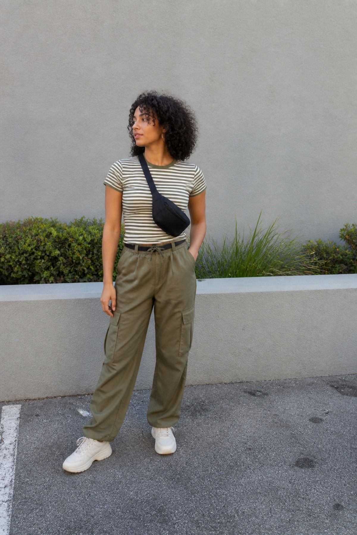 Woman wearing a striped shirt with cargo pants