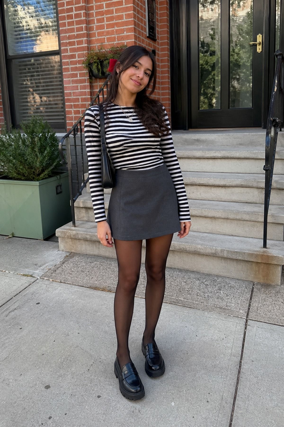 Woman wearing a striped shirt with a mini skirt