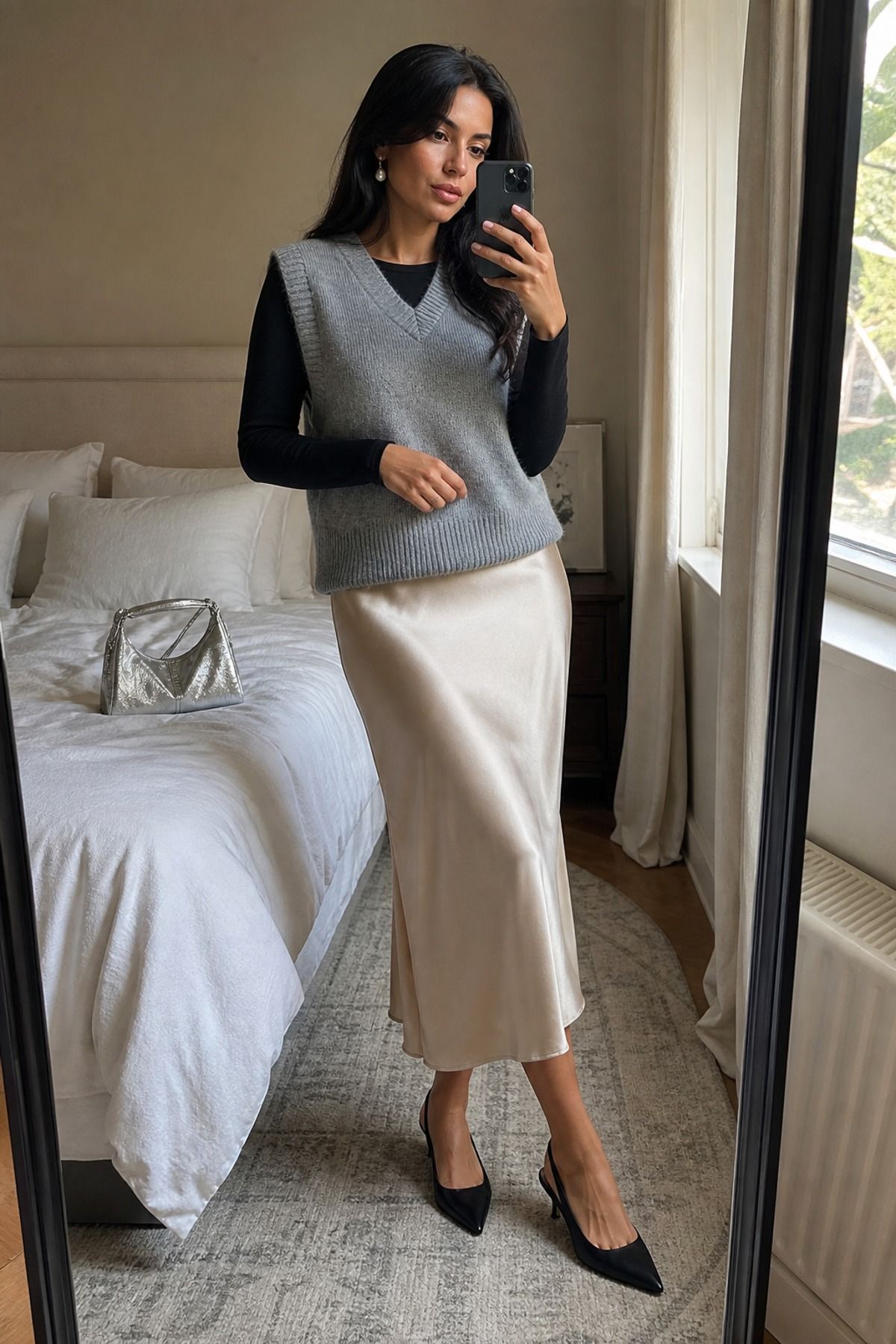 Woman wearing a knit vest with a slip skirt