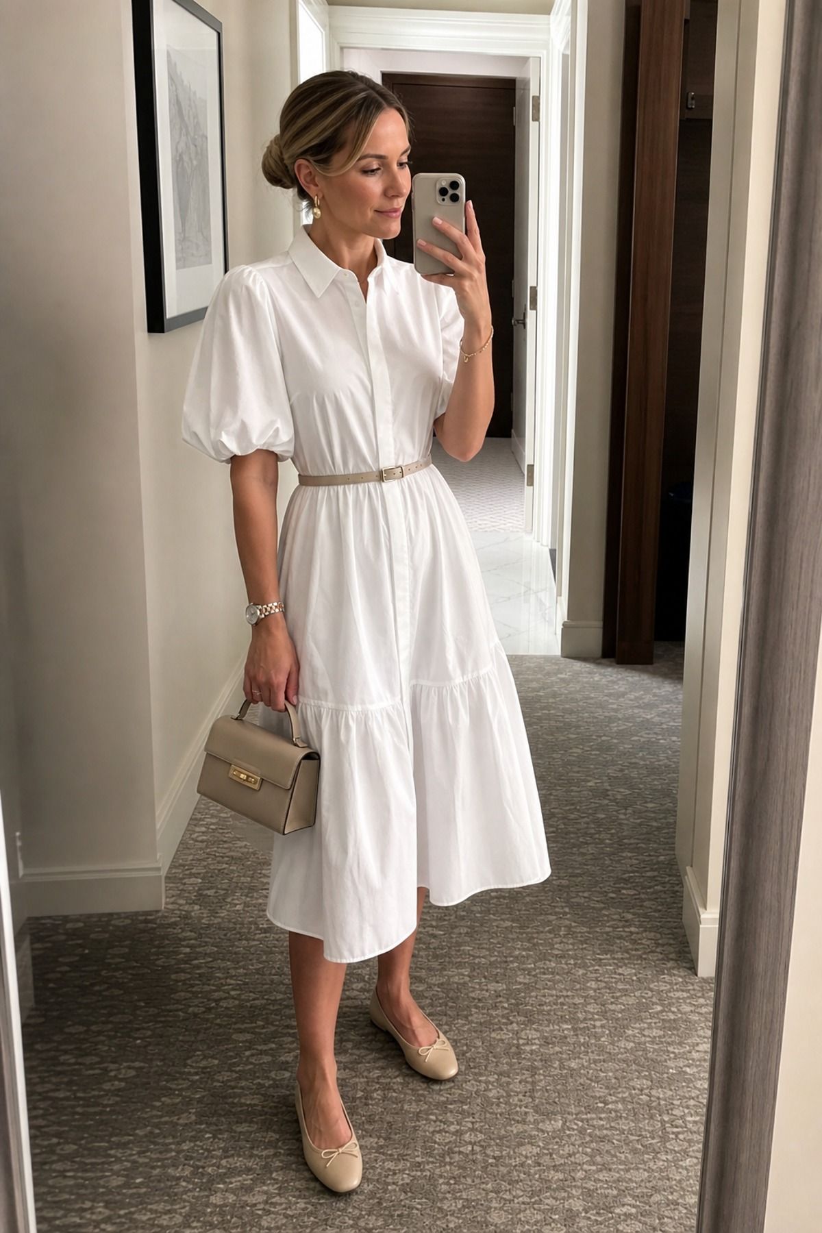 Woman wearing a white poplin dress with ballet flats, a white dress outfit