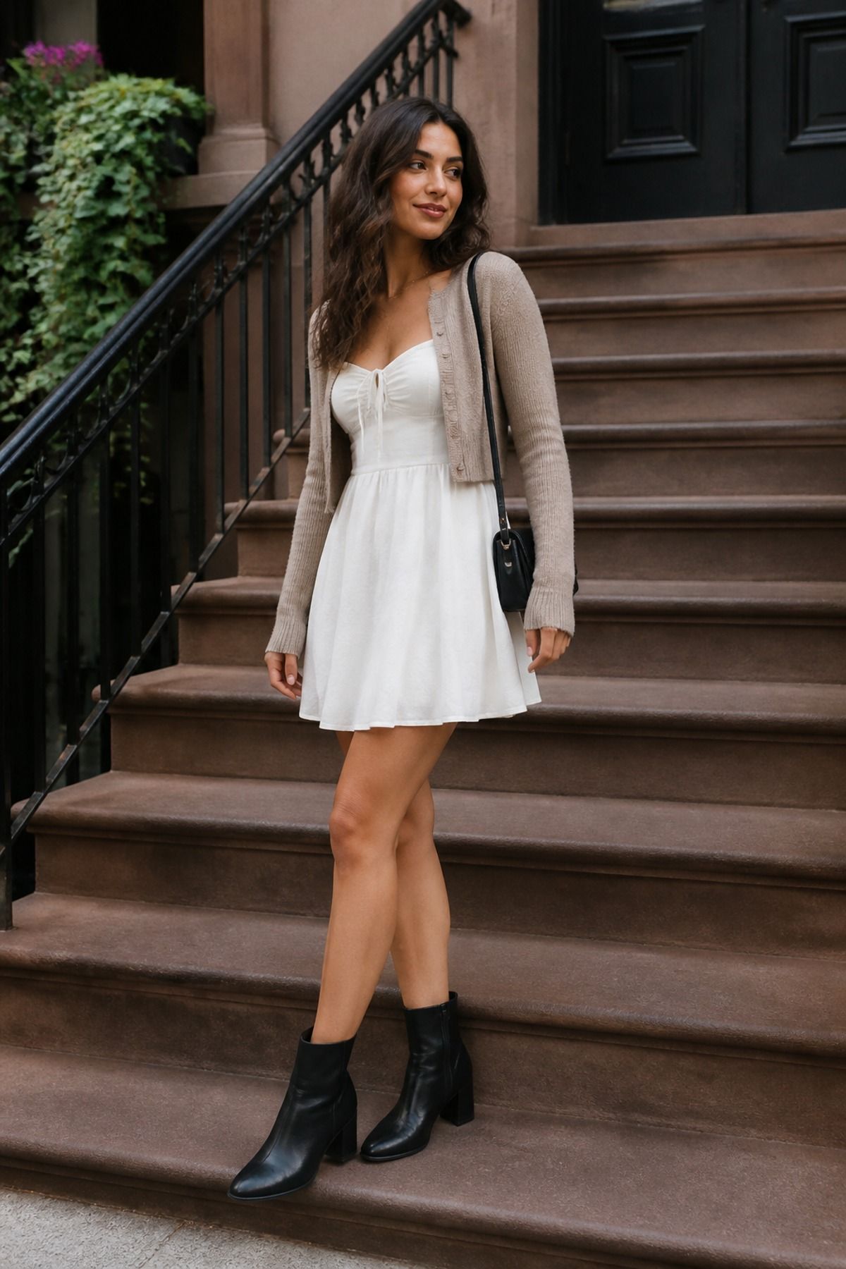 Woman wearing a white dress with ankle boots