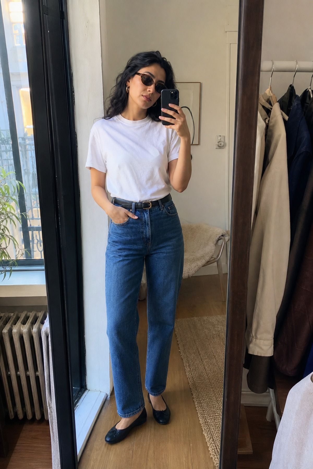 Woman wearing a white crew neck T-shirt with straight jeans
