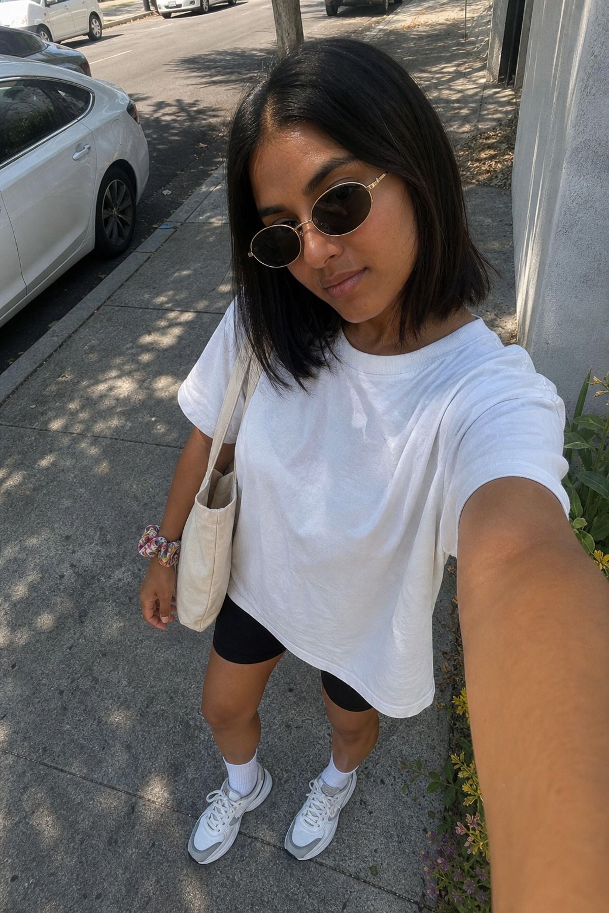Woman wearing a white oversized T-shirt with bike shorts