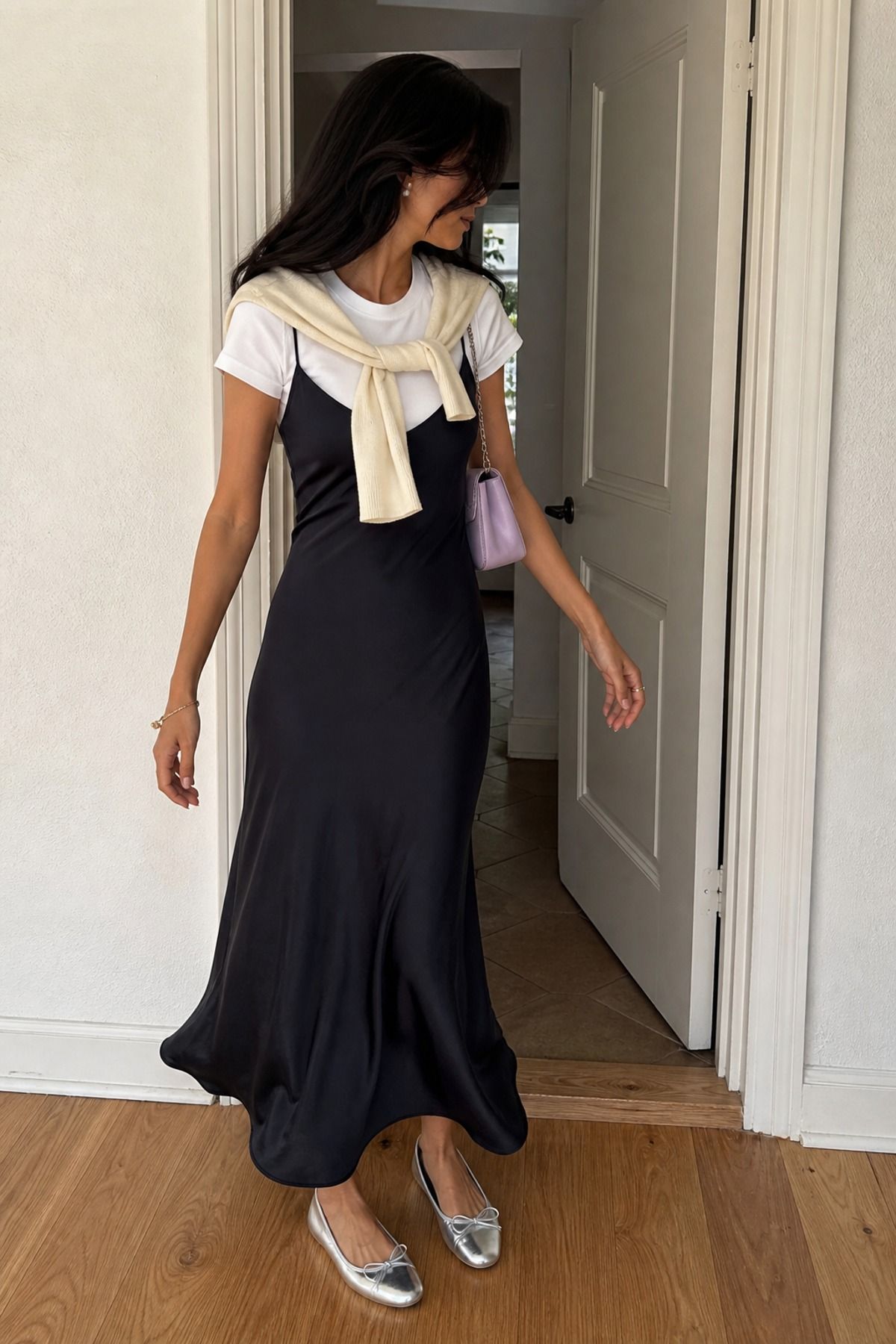 Woman wearing a white T-shirt with a slip dress layer