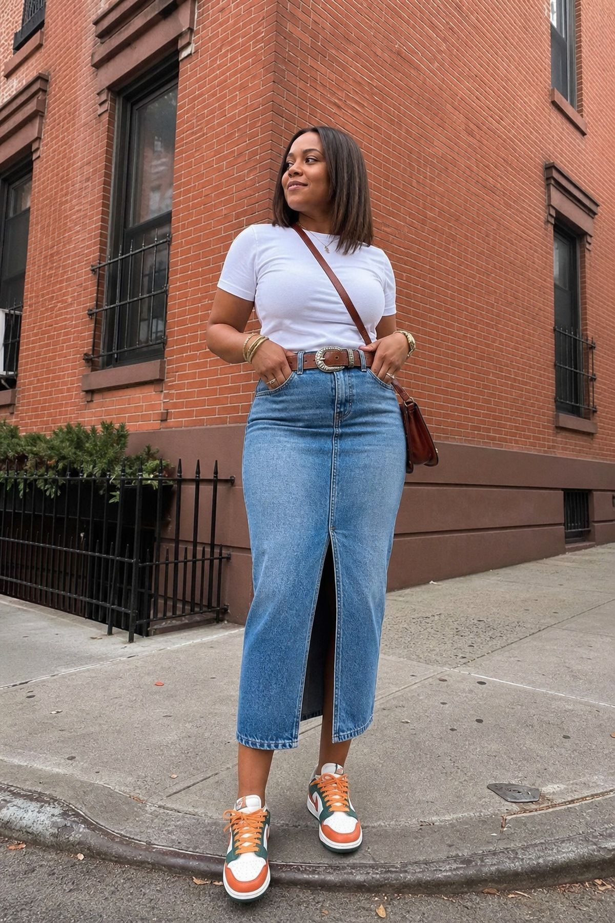 Woman wearing a denim skirt outfit with belt