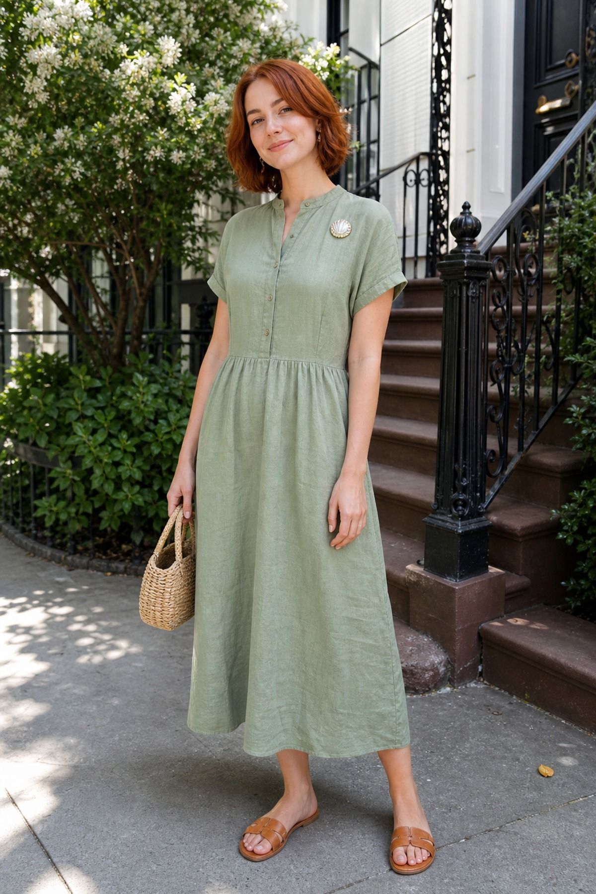 Woman wearing a linen dress with a brooch
