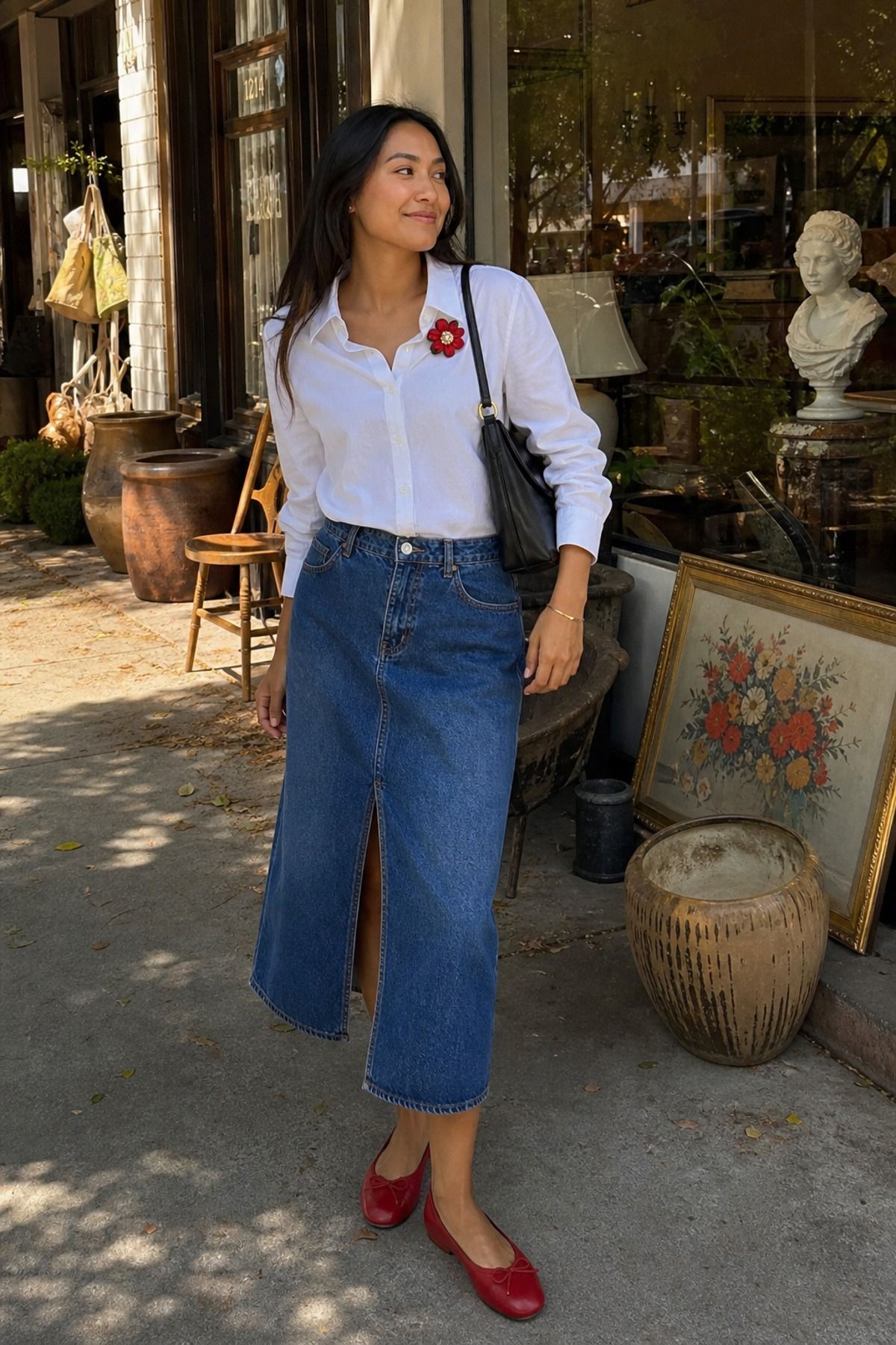 Woman wearing a denim skirt outfit with a brooch