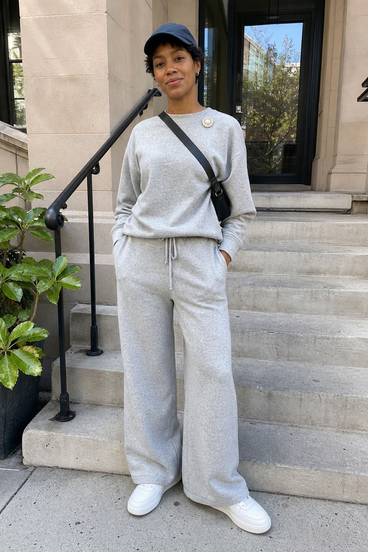Woman wearing a casual knit set with a brooch