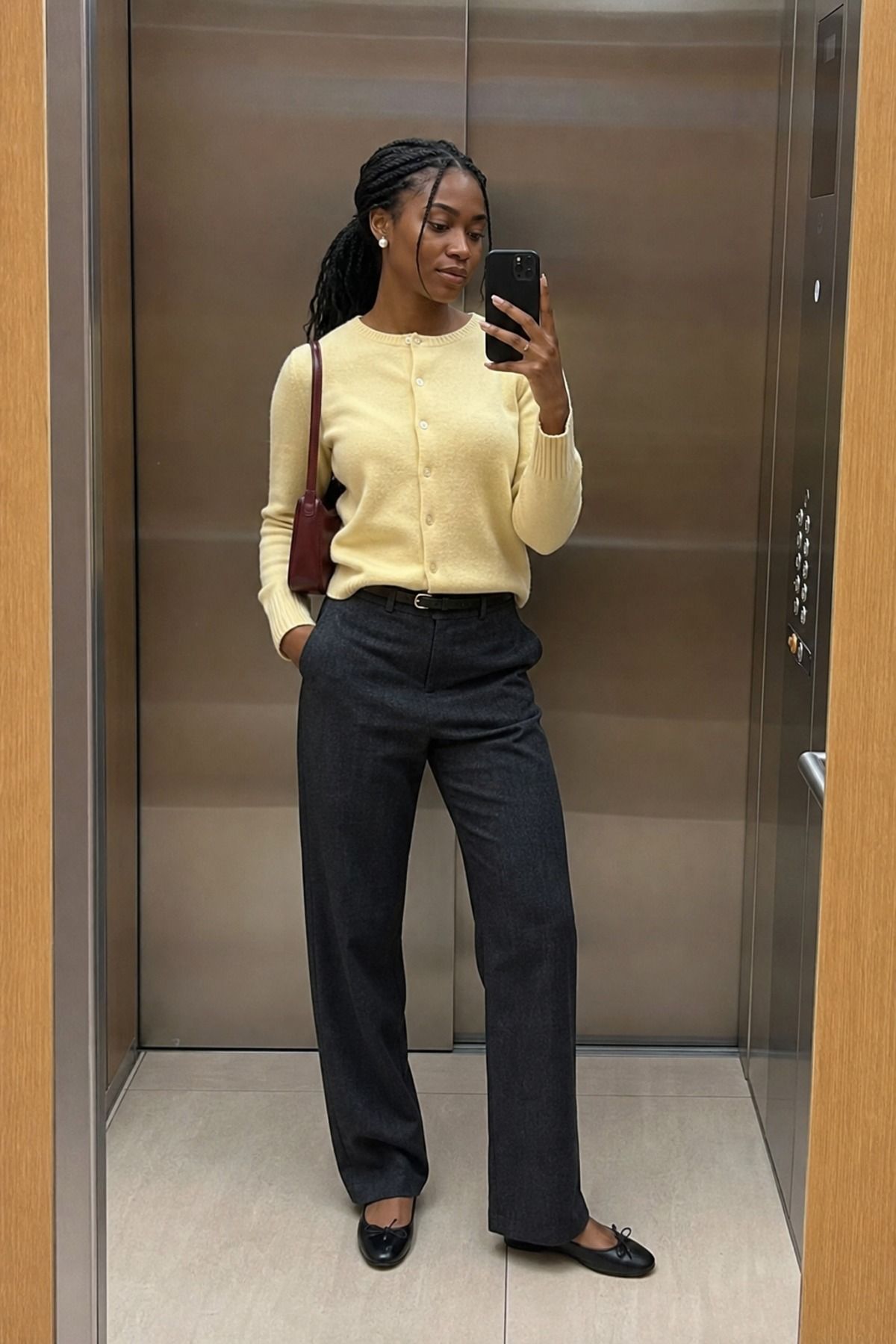 Woman wearing a fine knit cardigan with straight pants, a casual chic outfit