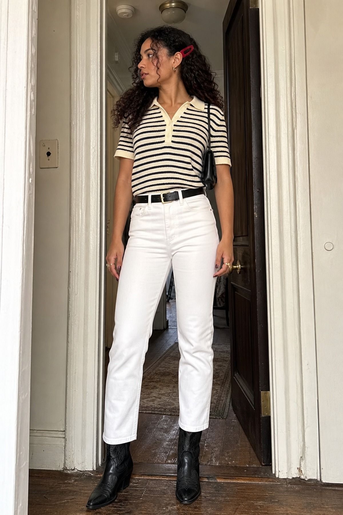 Woman wearing white jeans with cowboy boots