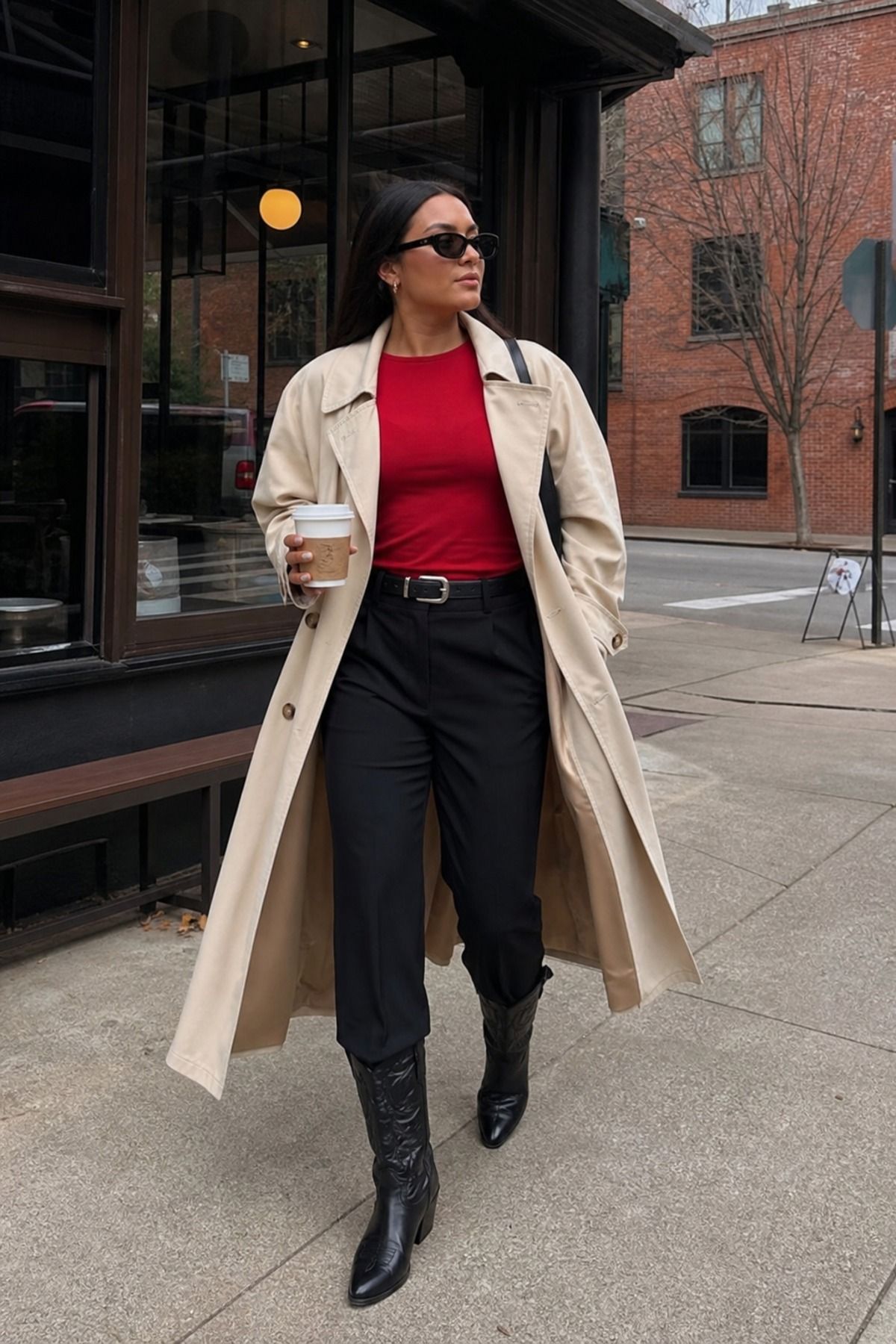 Woman wearing black trousers with cowboy boots